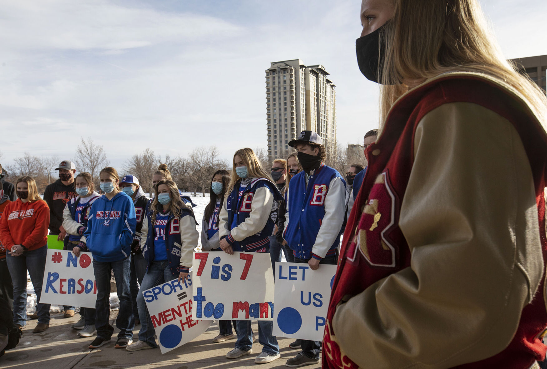 Colorado student athletes listen to students speak about how the postponement of sports is affecting them during the LetCOPlay protest at Creekside Park across from the office of the Colorado Department of Public Health and Environment in Glendale, Colo., on Thursday, Dec. 17, 2020. Over 50 people participated the protest in response to the CDPHE postponement of high school winter sports. (Chancey Bush/ The Gazette) (Chancey Bush)