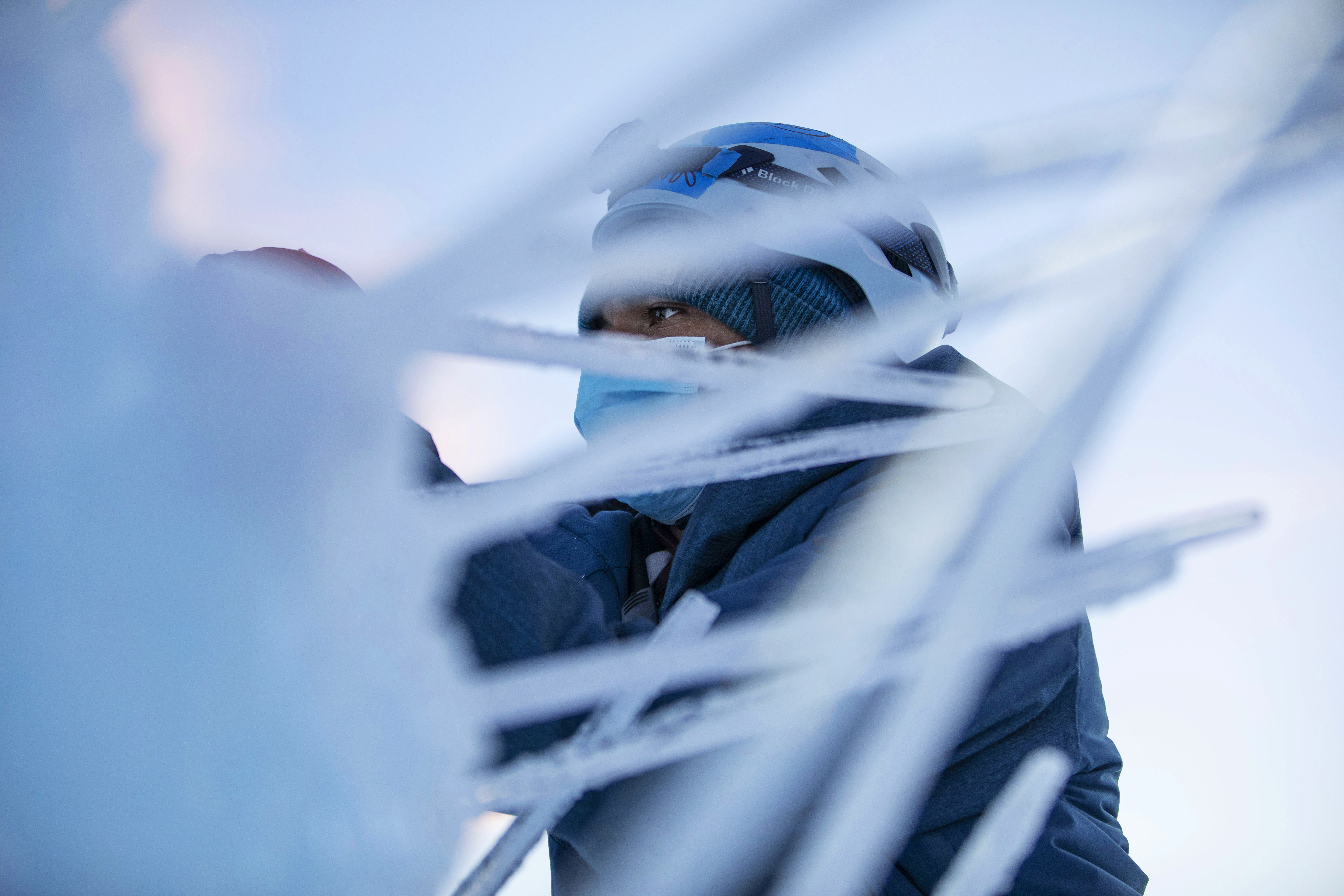 Edgar Vieira places icicles on sculptures inside the Dillon Ice Castles in Dillon, Colo., on Wednesday, Dec. 9, 2020. Ice artisans spend around six weeks placing up to 10,000 icicles each day to create the life-size winter fairytale built entirely from ice.The Ice Castles return for the fourth year with limited capacity due to the COVID-19 pandemic. The Ice Castles are expected to open around Christmas. (Chancey Bush/ The Gazette) (Chancey Bush/ The Gazette)