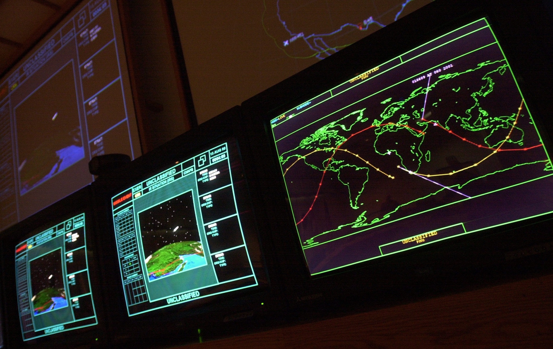 The screen at right in the Command Center at the Cheyenne Mountain Air Force Station shows the track of the Mir space station (the red line) and the International Space Station (the yellow line). Jay Janner/The Gazette 3/1/01 (Jay Janner)