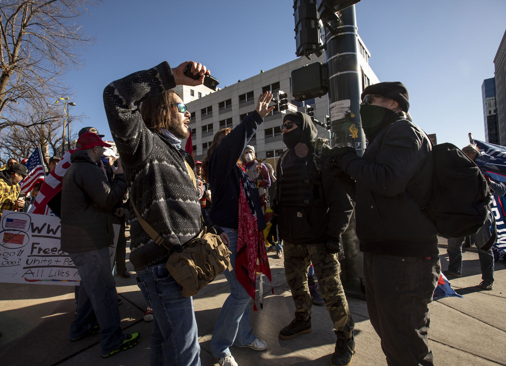 A protester threatens a counter-protester with a taser during the 