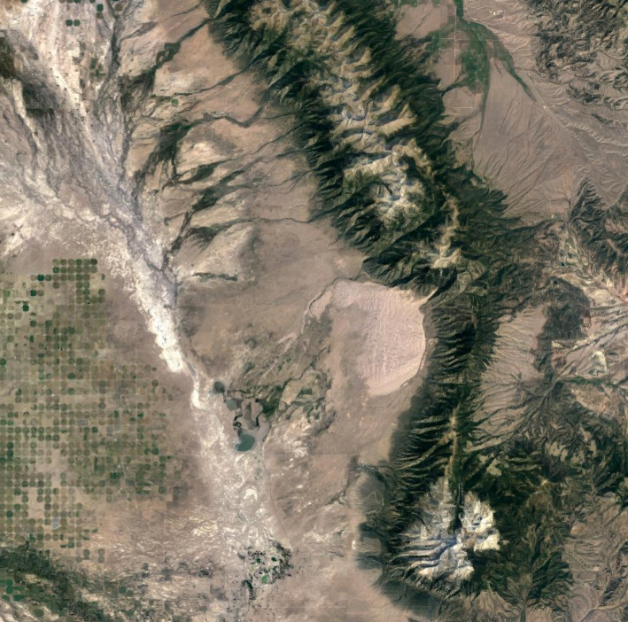 4. The Great Sand DunesFound on the edge of the San Luis Valley, the Great Sand Dunes look surprisingly quaint from space. They can be seen in this image as the small circular spot near the middle of the frame, with agricultural efforts in the valley seen to their left and the Sangre de Cristo mountains rising on the right.Photo Credit: @2021 Google Maps
