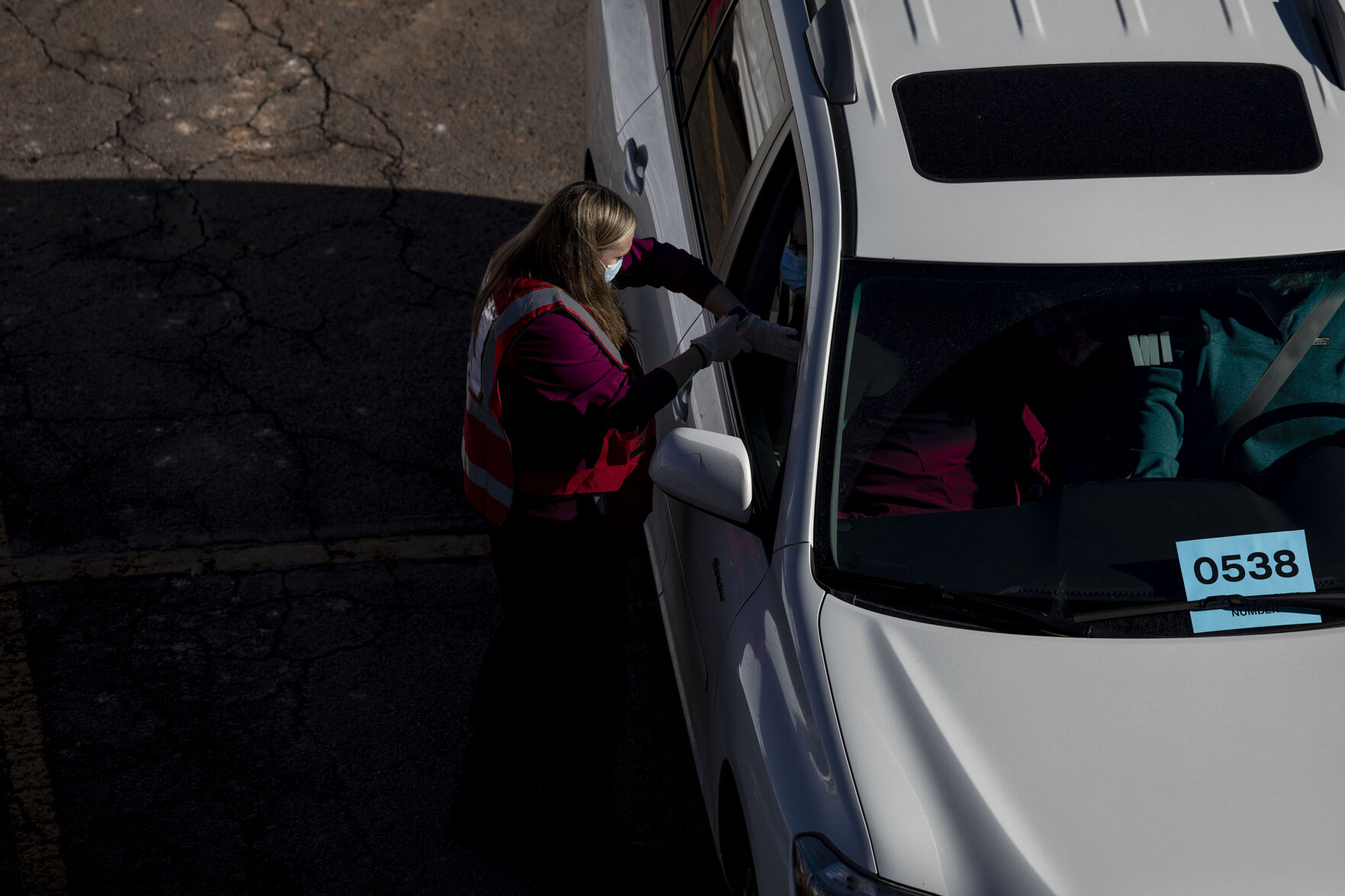 UCHealth's large-scale COVID-19 vaccination drive-thru site at the Coors Field parking lot in Denver, Colo., on Saturday, Jan. 30, 2021. The vaccination site is the largest in the state with 10,000 seniors expected to be vaccinated through the weekend. (Chancey Bush/ The Gazette) (Chancey Bush/ The Gazette)