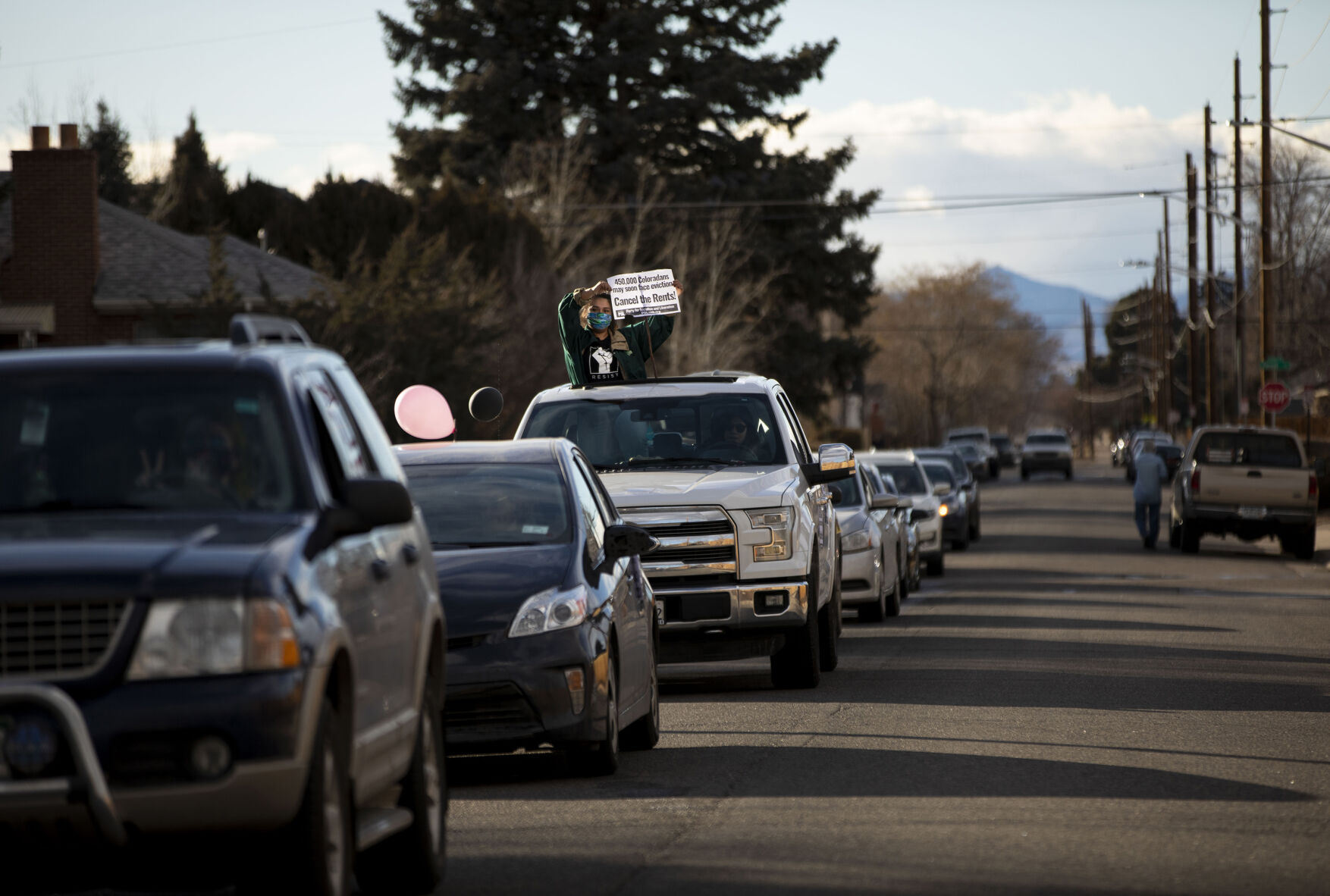 The Denver chapter of the Party for Socialism and Liberation and 9to5 Colorado hold a ‘Cancel the Rent’ car protest as vehicles make their way down 29th Avenue in Denver, Colo., on Saturday, Jan. 30, 2021. The protest was a national day of action with 30 planned for this weekend by PSL chapters in cities around the U.S to ask for government intervention to head off a worsening housing crisis. The concern over eviction moratoriums expiring in April will mean a renewed wave of evictions for residents in Colorado. 