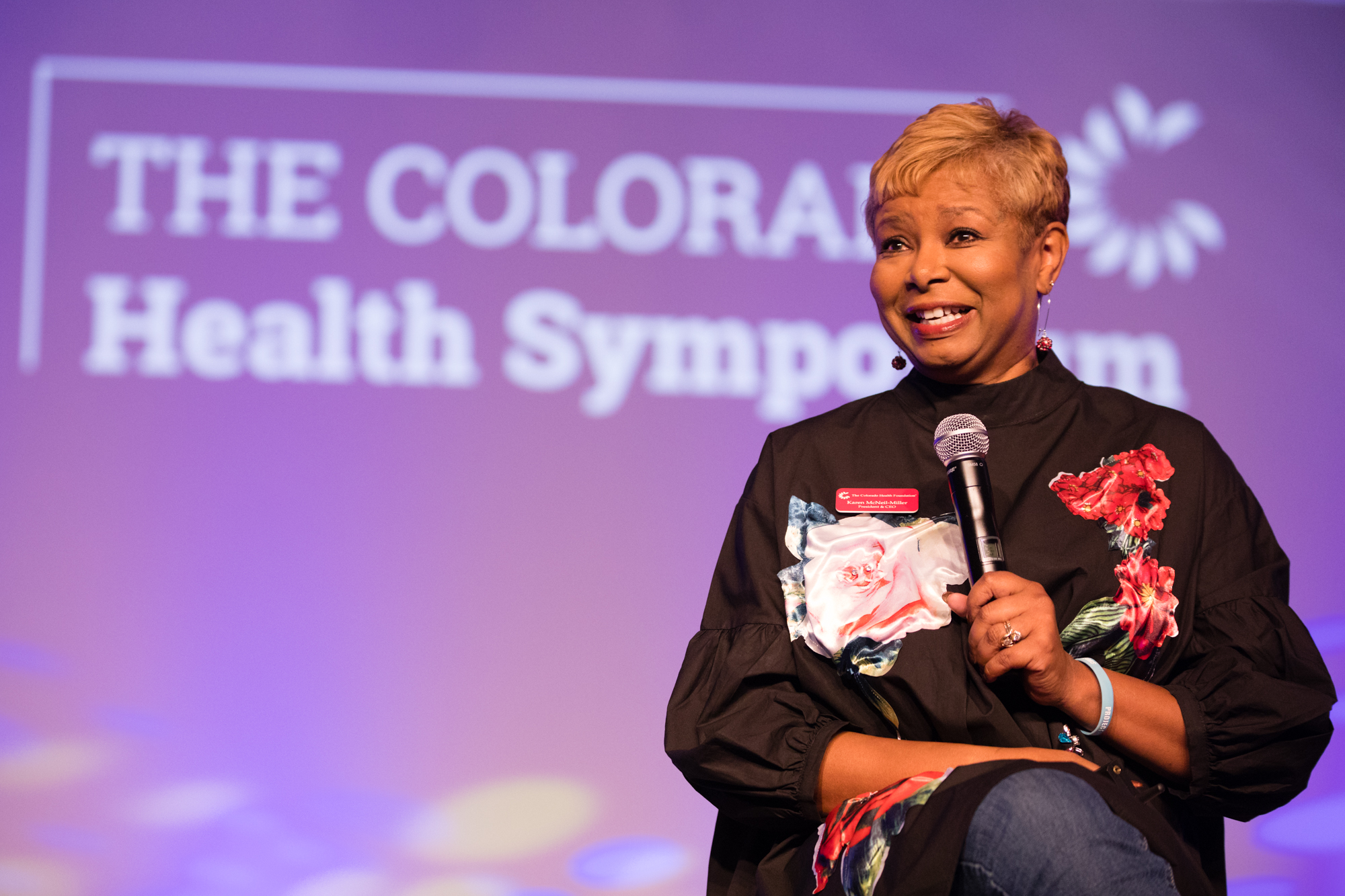 CEO and President of the Colorado Health Foundation Karin McNeil-Miller speaking at a health symposium. CHF was recently named a recipient of Colorado Governor's Citizenship Award, for COVID-19. (Courtesy of Colorado Health Foundation)