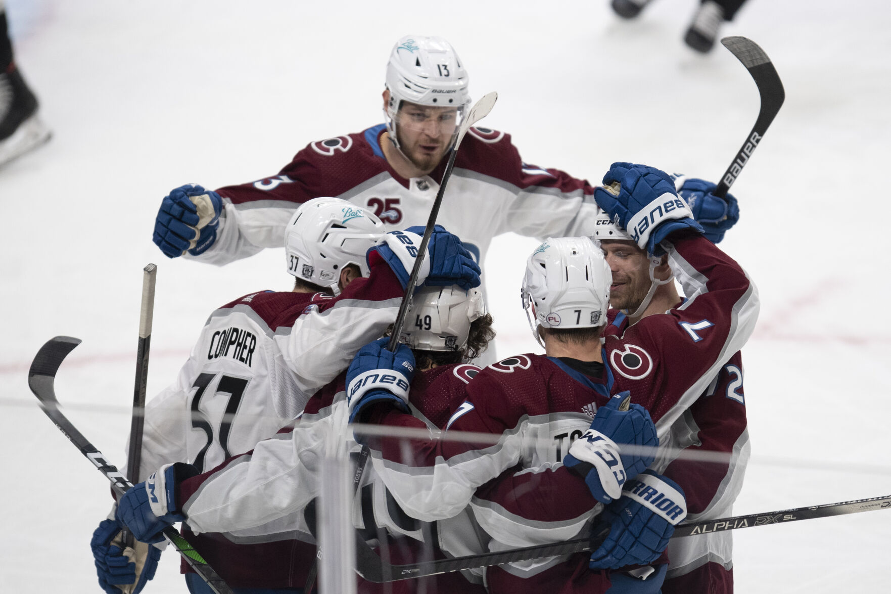 Colorado Avalanche players celebrate defenseman Devon Toews' goal during the second period of the team's NHL hockey game against the Los Angeles Kings on Tuesday, Jan. 19, 2021, in Los Angeles. (AP Photo/Kyusung Gong) (Kyusung Gong)