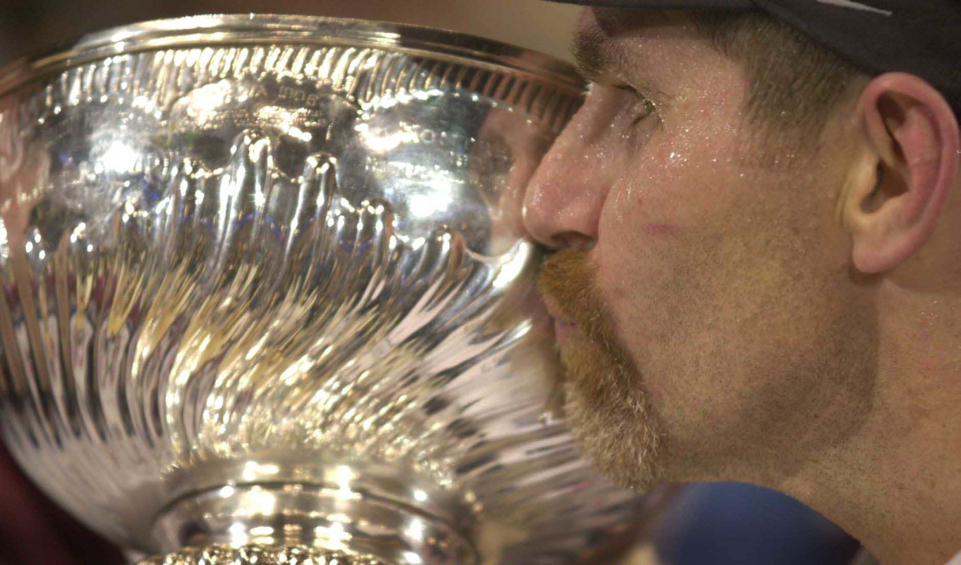 Ray Bourque kisses the Stanley Cup following game seven of the Stanley Cup Finals at the Pepsi Center in Denver Saturday, June 9, 2001. (Mark Reis, The Gazette file photo)