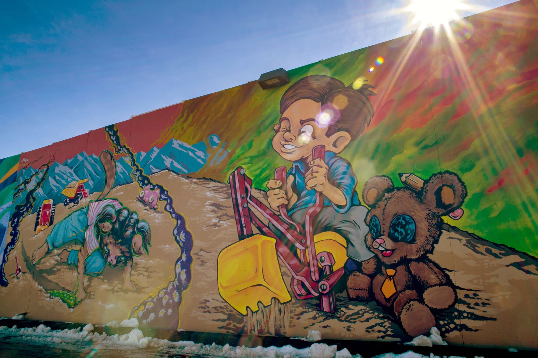 A mural created by Denver artist Joshua Finely is seen on the wall between Swansea Elementary and the Interstate 70 viaduct in October. It shows the feelings of the some of the Globeville and Elyria-Swansea residents toward the freeway construction. (Christian Murdock, The Gazette)