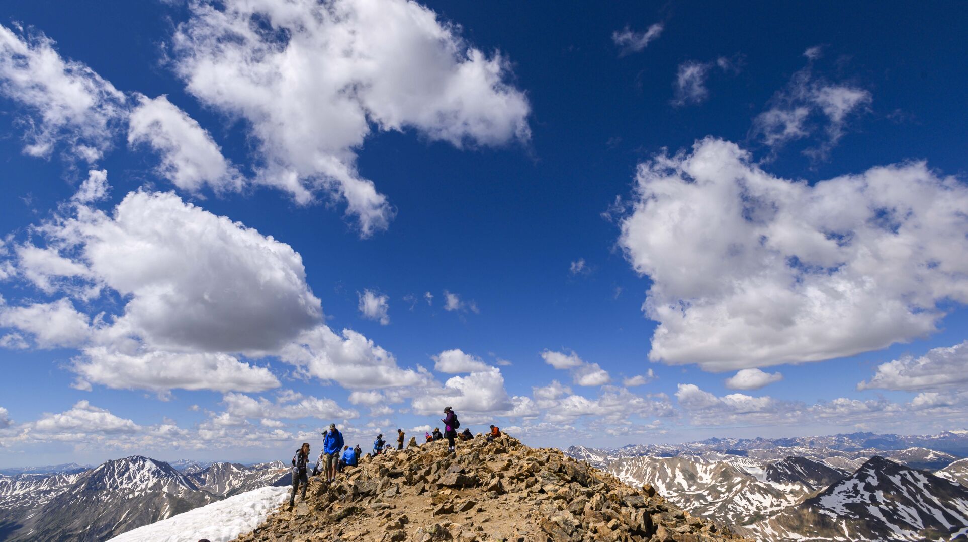 Climbers gather on the summit of 14,433-foot Mount Elbert on a busy Saturday morning last June. (CHRISTIAN MURDOCK, THE GAZETTE)