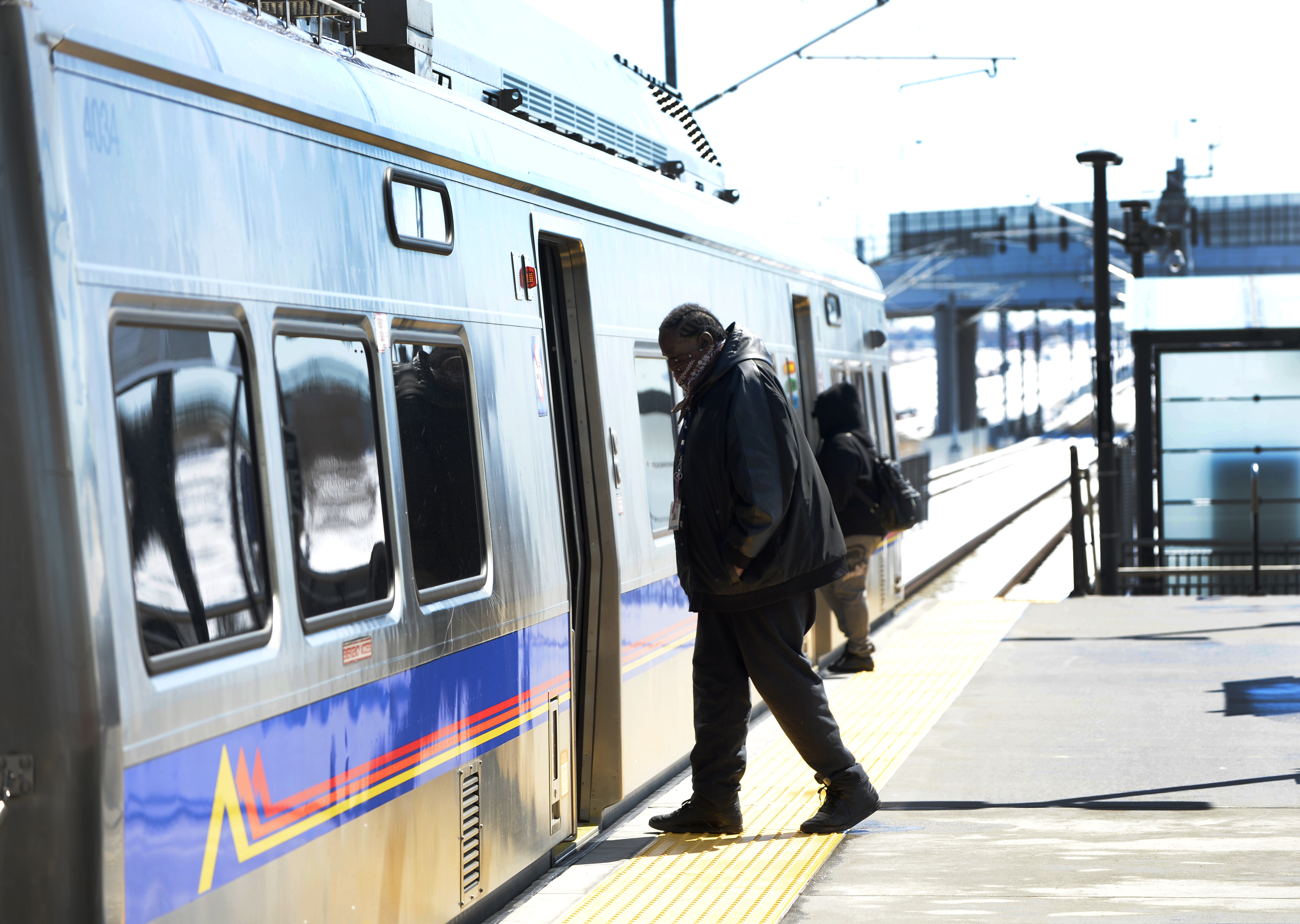 Riders board the eastbound RTD University of Colorado A Line train from the Central Park Station on Smith Road in Denver on April 17, 2020. ((Photo By Kathryn Scott))