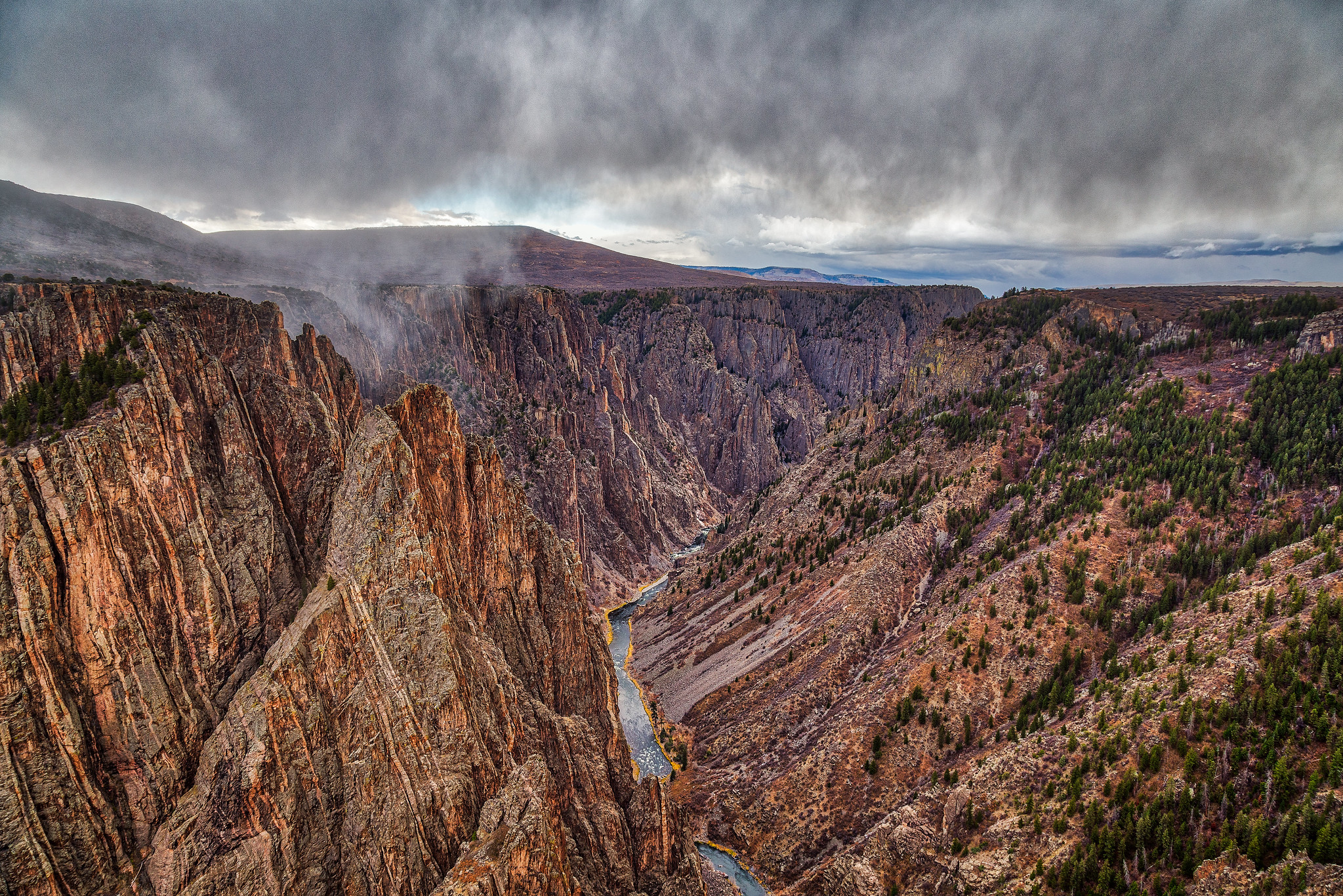 Black Canyon of the Gunnison National ParkA 14-mile portion of the Black Canyon of the Gunnison, along with 30,750 acres of wilderness, was established as a national park in 1999. The park was named for the towering cliffs that are so tall they appear black most of the time. The sun has trouble reaching their depths.Credit: Mobilus In Mobili (Flickr).
