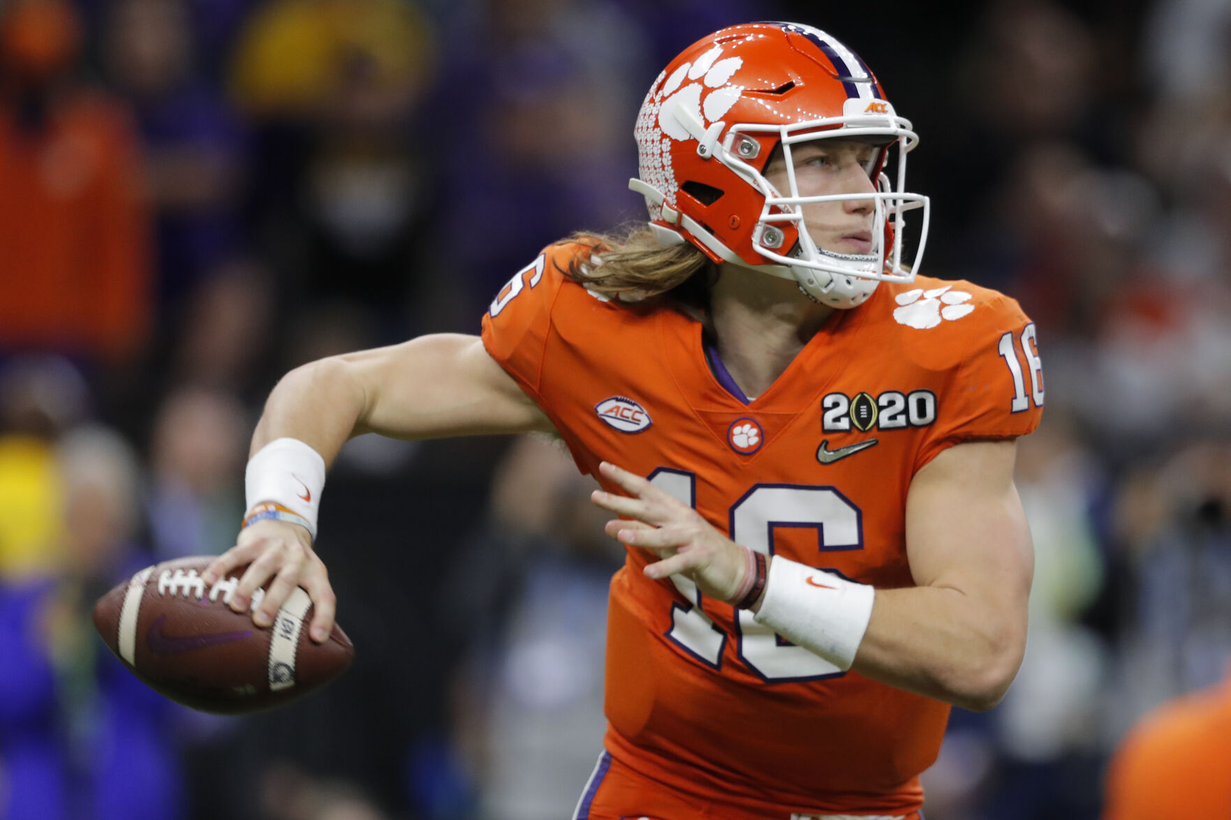 Clemson quarterback Trevor Lawrence looks to pass Jan. 13 against LSU during the second half of an NCAA College Football Playoff national championship game in New Orleans. The top-ranked Tigers have dominated with Lawrence. (the associated press)