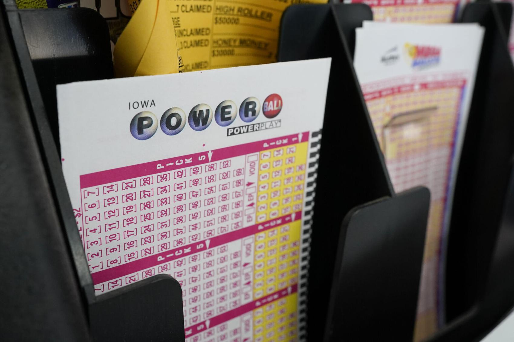Blank forms for the Powerball lottery sit in a bin at a grocery store, Tuesday, Jan. 12, 2021. Charlie Neibergall - staff, AP