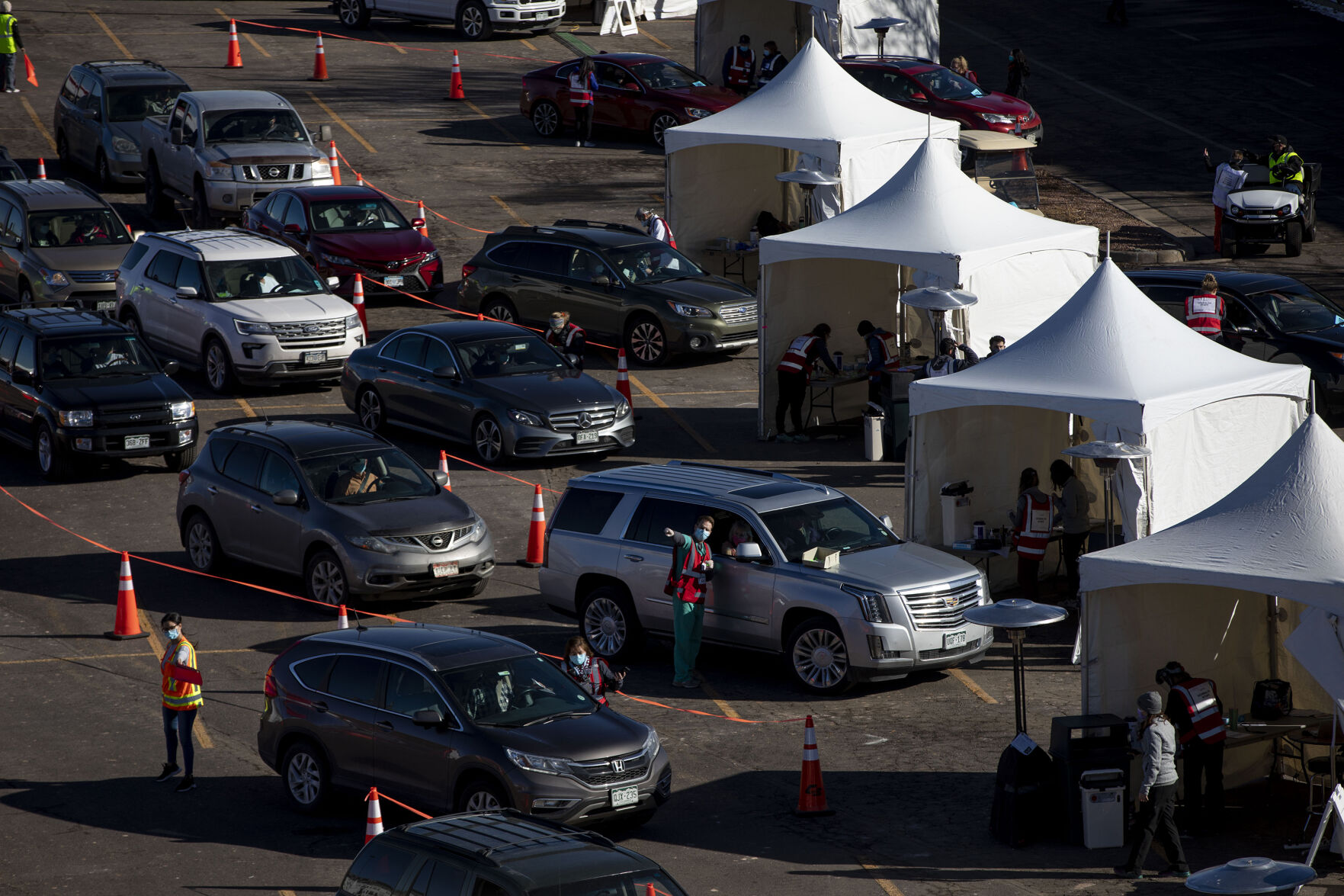 UCHealth's large-scale COVID-19 vaccination drive-thru site at the Coors Field parking lot in Denver Colo., on Saturday, Jan. 30, 2021. The vaccination site is the largest in the state with 10,000 seniors expected to be vaccinated through the weekend. (Chancey Bush/ The Gazette) (Chancey Bush/ The Gazette)