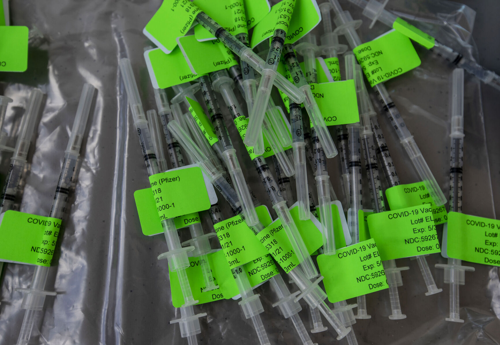 COVID-19 vaccinations wait to be administered during UCHealth's large-scale COVID-19 vaccination drive-thru site at the Coors Field parking lot in Denver Colo., on Saturday, Jan. 30, 2021. The vaccination site is the largest in the state with 10,000 seniors expected to be vaccinated through the weekend. (Chancey Bush/ The Gazette) (Chancey Bush/ The Gazette)