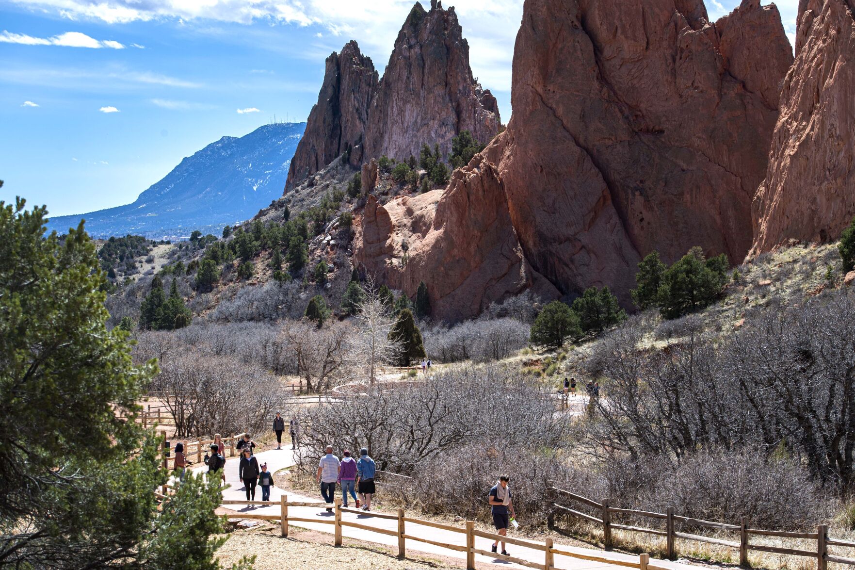 Visitors walk through Garden of the Gods Park on a sunny day, Wednesday, March 25, 2020, as Colorado Springs Mayor John Suthers is encouraging all hikers, bikers, bird watchers and 