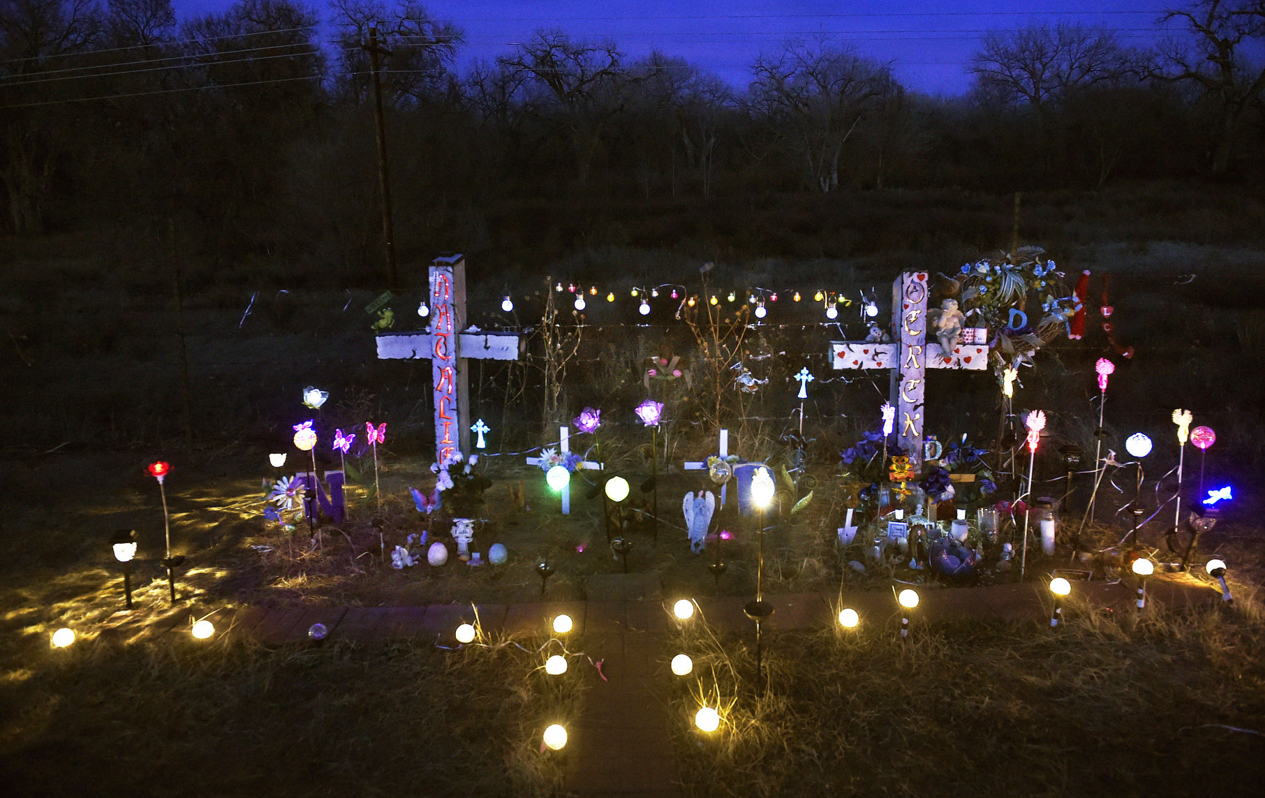 The names Natalie and Derek are carved into two crosses at the scene of a double murder on Old Pueblo Road, south of Fountain. About 70 solar lights light up the location where Coronado High School students Natalie Cano-Partida and Derek Greer were shot repeatedly execution style March 11, 2017. The photo was taken in March 2018. (JERILEE BENNETT, THE GAZETTE File)