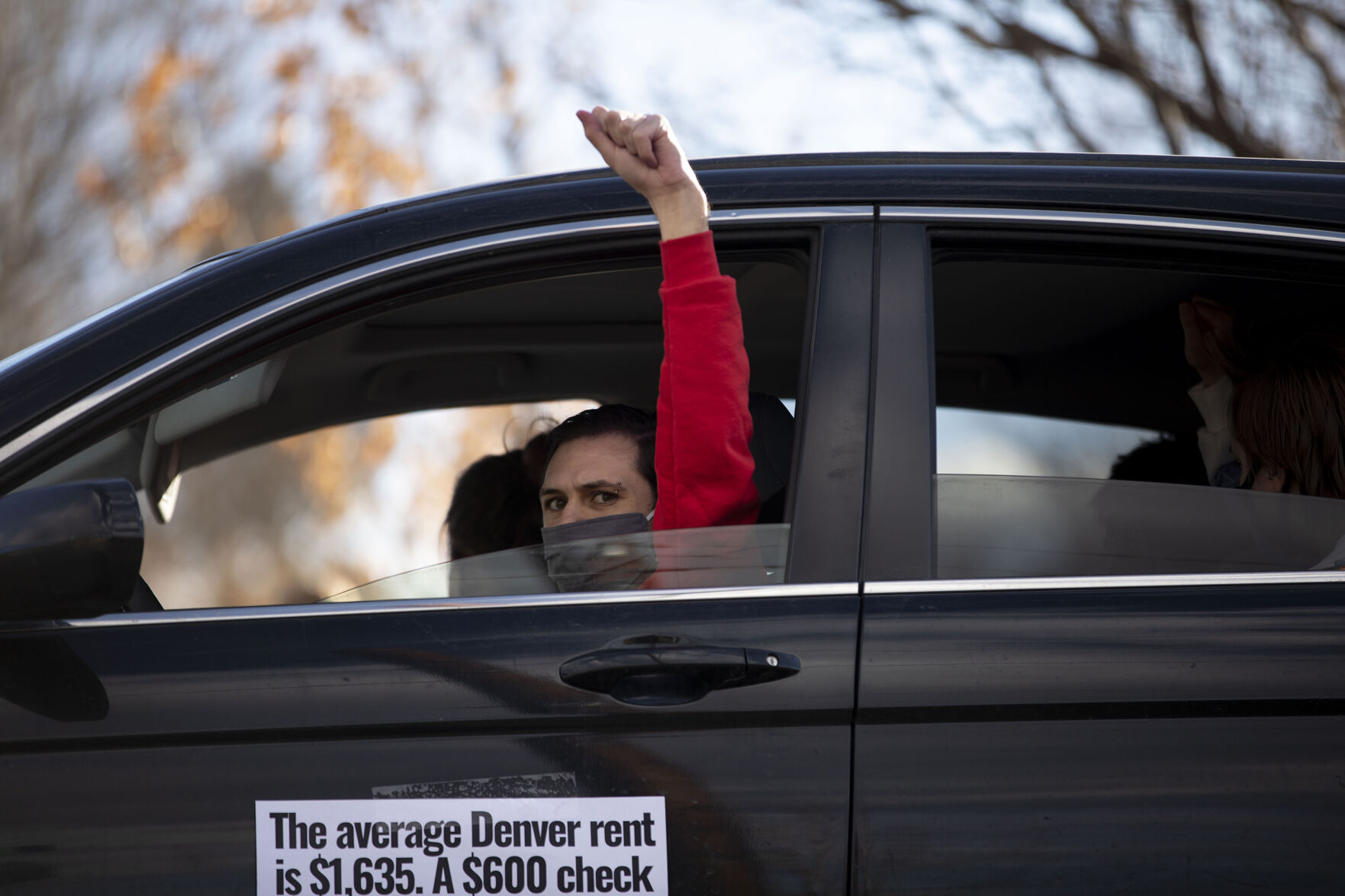 The Denver chapter of the Party for Socialism and Liberation and 9to5 Colorado hold a ‘Cancel the Rent’ car protest as vehicles make their way down 29th Avenue in Denver, Colo., on Saturday, Jan. 30, 2021. The protest was a national day of action with 30 planned for this weekend by PSL chapters in cities around the U.S to ask for government intervention to head off a worsening housing crisis. The concern over eviction moratoriums expiring in April will mean a renewed wave of evictions for residents in Colorado. 