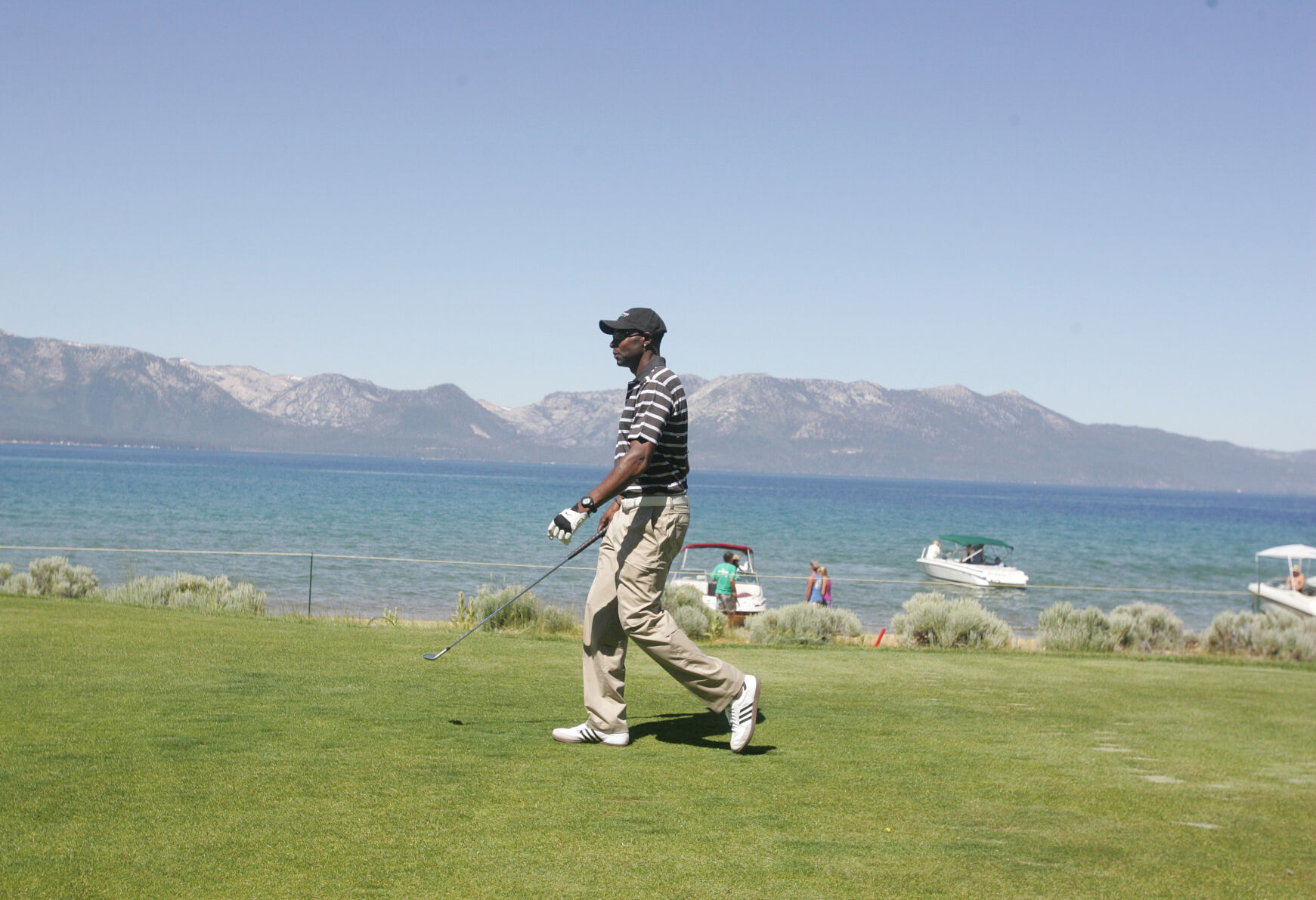 Jerry Rice walks along the 17th hole's fairway during the American Century Golf Championship at Edgewood Tahoe Golf Course in Stateline, Nev., on Thursday, July 16, 2009. (AP Photo/Brad Horn) (Brad Horn)