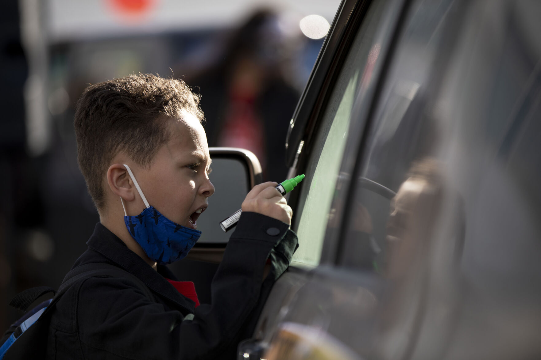 Joshua Clark, 8, helps write on cars in preparation for the Denver chapter of the Party for Socialism and Liberation and 9to5 Colorado holding a ‘Cancel the Rent’ car protest in Denver, Colo., on Saturday, Jan. 30, 2021. The protest was a national day of action with 30 planned for this weekend by PSL chapters in cities around the U.S to ask for government intervention to head off a worsening housing crisis. The concern over eviction moratoriums expiring in April will mean a renewed wave of evictions for residents in Colorado. 