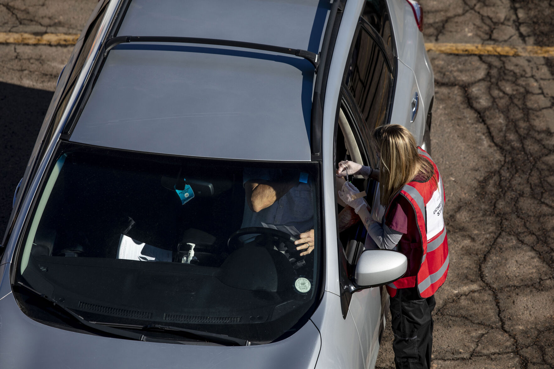UCHealth's large-scale COVID-19 vaccination drive-thru site at the Coors Field parking lot in Denver Colo., on Saturday, Jan. 30, 2021. The vaccination site is the largest in the state with 10,000 seniors expected to be vaccinated through the weekend. (Chancey Bush/ The Gazette) (Chancey Bush/ The Gazette)
