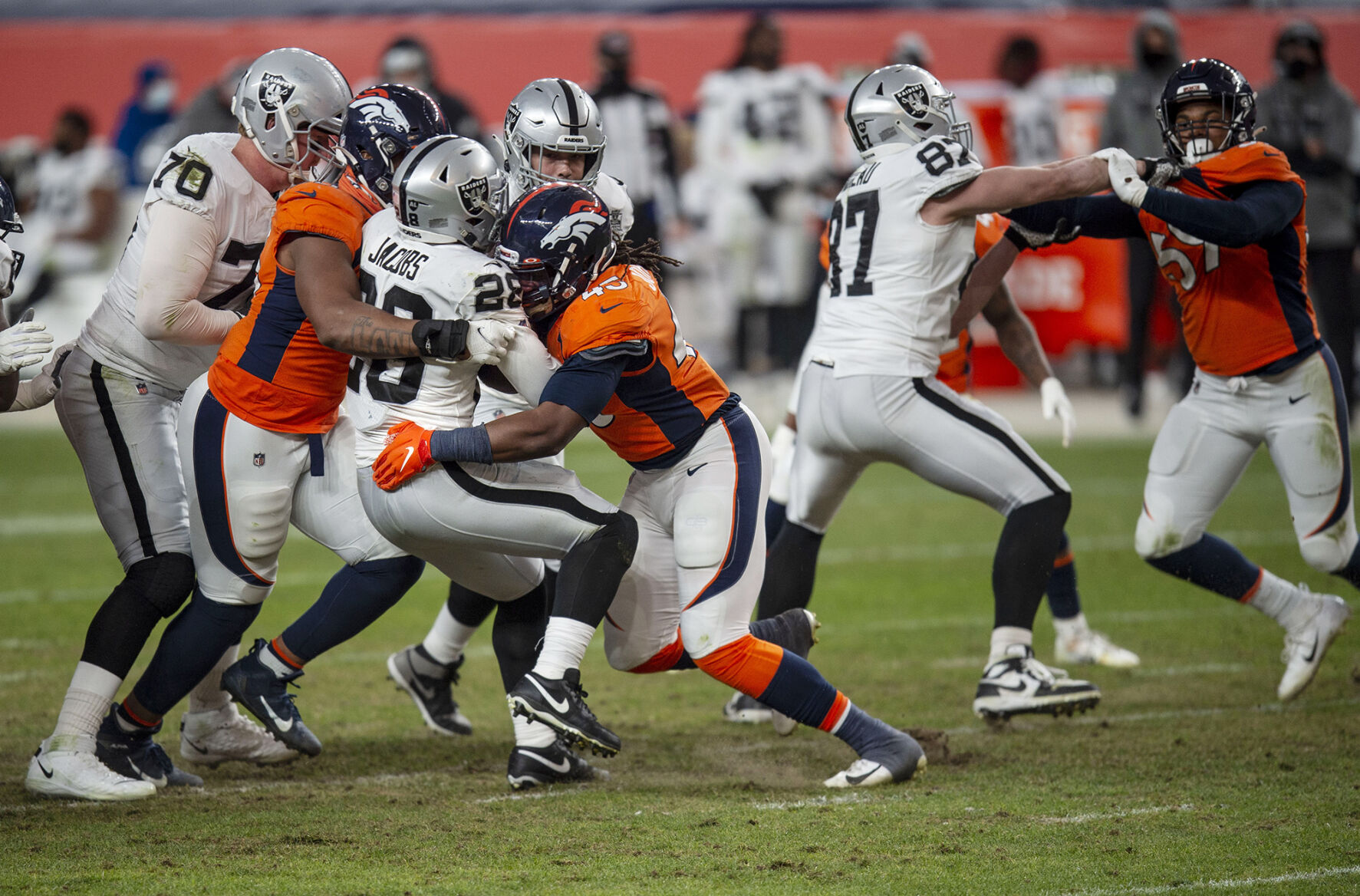 Denver Broncos inside linebacker A.J. Johnson (45) blocks in and tackles Las Vegas Raiders running back Josh Jacobs (28) as the Denver Broncos take on the Las Vegas Raiders at Empower Field at Mile High in Denver, Colo., on Sunday, Jan. 3, 2021. The Broncos lost their season finale game to the Raiders by a score of 32-31. (Chancey Bush/ The Gazette) (Chancey Bush/ The Gazette)