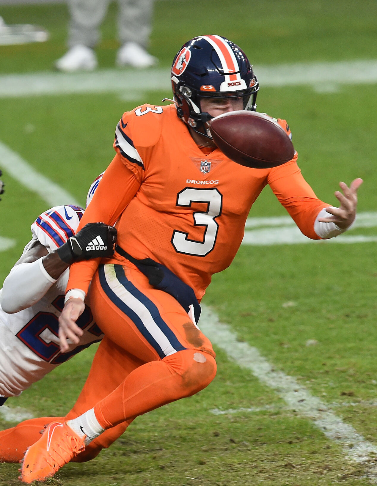 Broncos quarterback Drew Lock coughs up the ball while being sacked by Bills cornerback Tre’Davious White during the third quarter of a game at Empower Field at Mile High on Sunday, Dec. 19, 2020. The Bills beat the Broncos 48-19. (Photo by Jerilee Bennett, The Gazette) (JERILEE BENNETT)