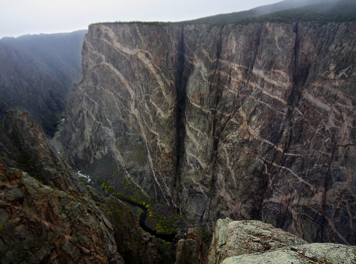 Black Canyon’s Painted WallBlack Canyon’s Painted Wall is Colorado’s highest cliff. The 2,250-foot cliff has been weathered and eroded to the point that colorful streaks of rock have been revealed.Photo Credit: MichaelJust (iStock).