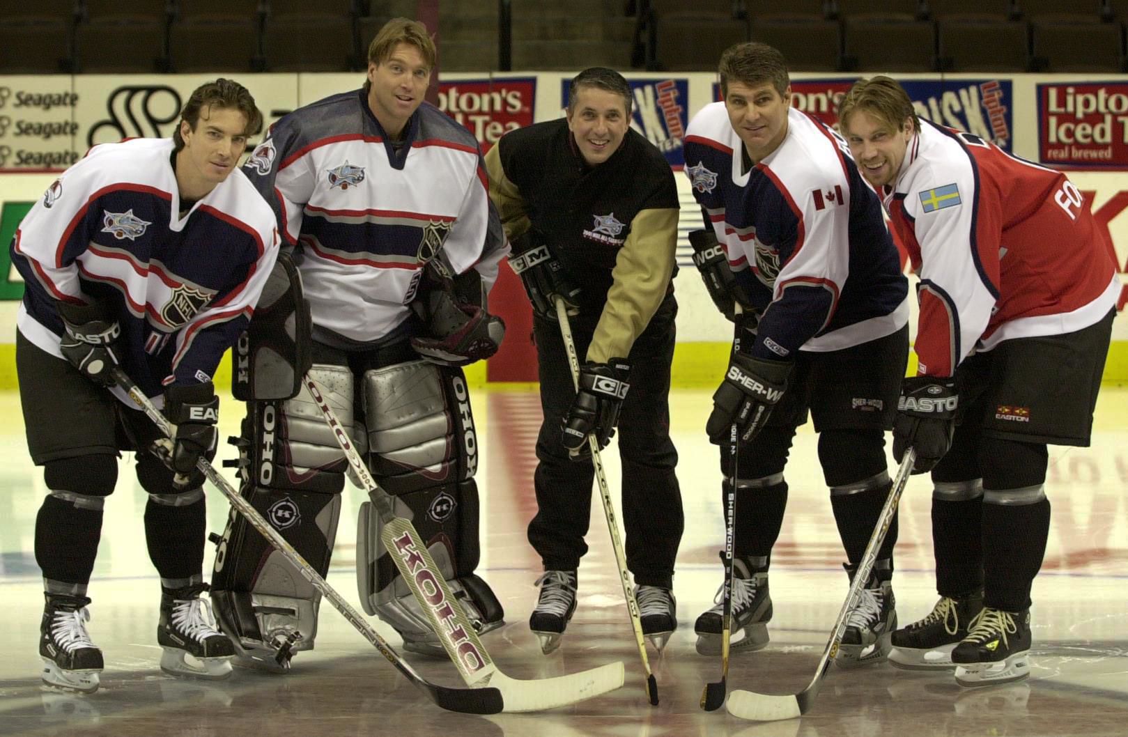 Colorado Avalanche NHL All-Stars representatives, from left, Joe Sakic, Patrick Roy, coach Bob Hartley, Ray Bourque and Peter Forsberg pose on the ice at Pepsi Center Thursday afternoon, Jan. 18, 2001. (Kevin Kreck)