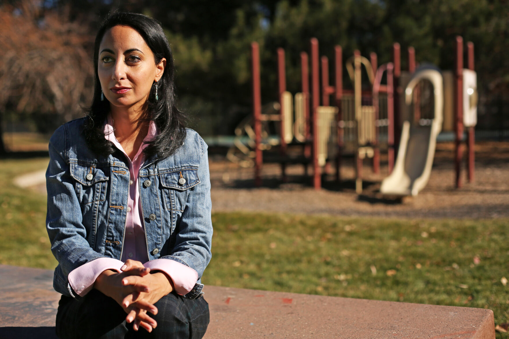 Iman Jodeh is the representative-elect for House District 41 in Aurora, the city she grew up in and has spent the past 35 years of her life. Here, she poses for a portrait in Havana Heights Park at the very same picnic bench and playground where she spent countless days as a child at. Jodeh is the first Muslim to ever be elected to the Colorado state legislature, although she has long been a familiar face at the Capitol because of her passion for activism and community engagement. (Forrest Czarnecki/The Gazette) (Forrest Czarnecki)