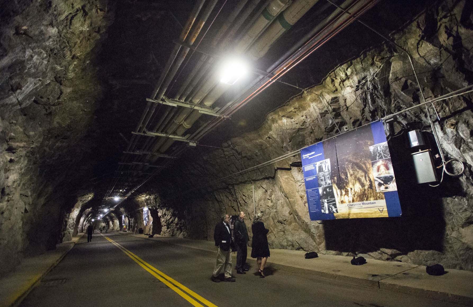 Guests read about the history of Cheyenne Mountain Air Force Station as they tour the tunnel leading into the bunker during the 50th anniversary celebration of the Cheyenne Mountain Complex. The Air Force station, owned and operated by Air Force Space Command, began operating Feb. 6, 1967, as the NORAD Combat Operations Center. (The Gazette file)