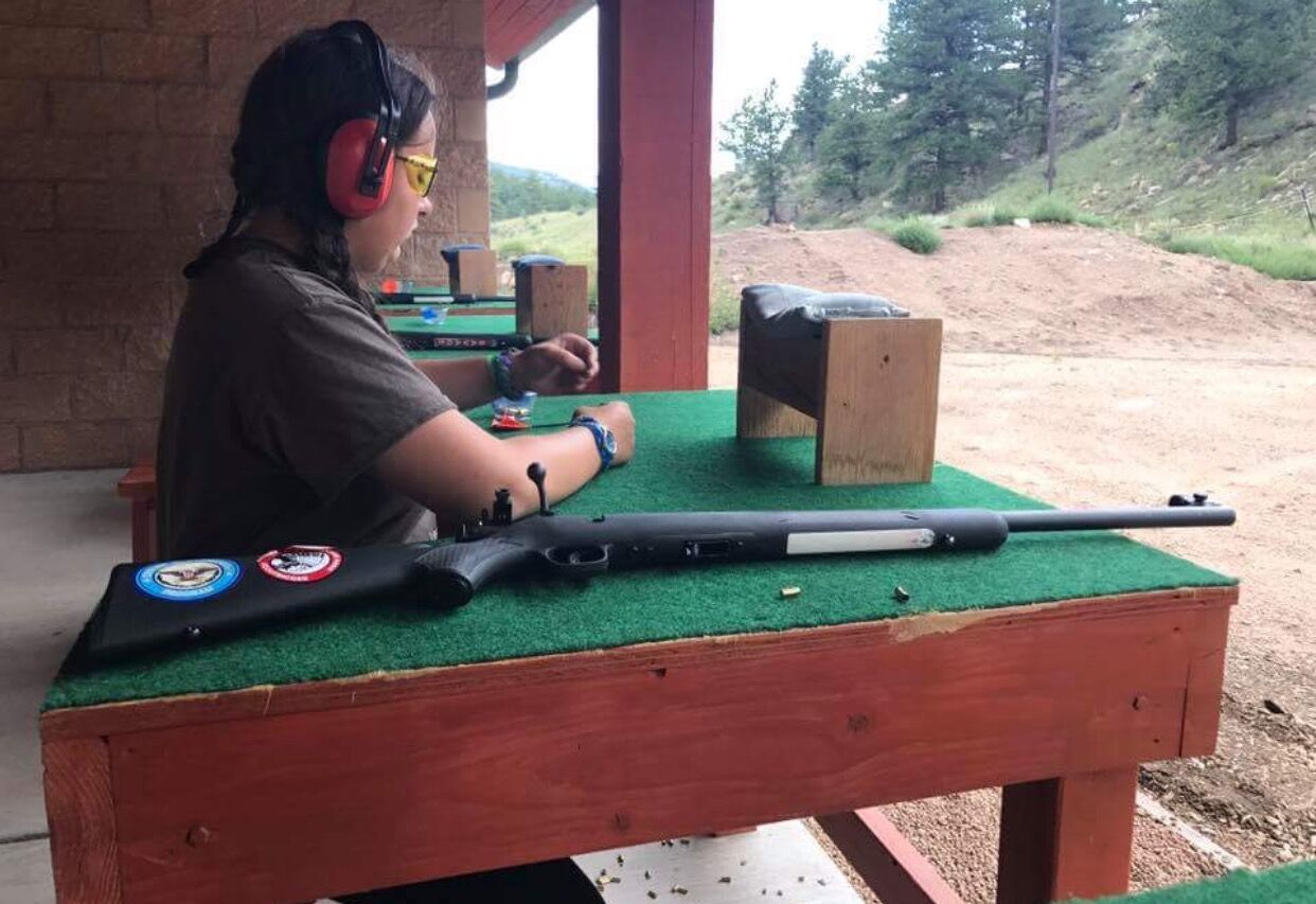 Sierra Dooley works toward her Rifle Shooting merit badge. (Courtesy of Jonathan Dooley)