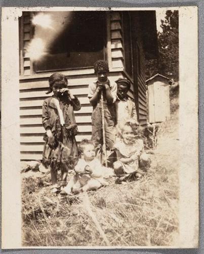 Nancelia and family at cabin.jpg