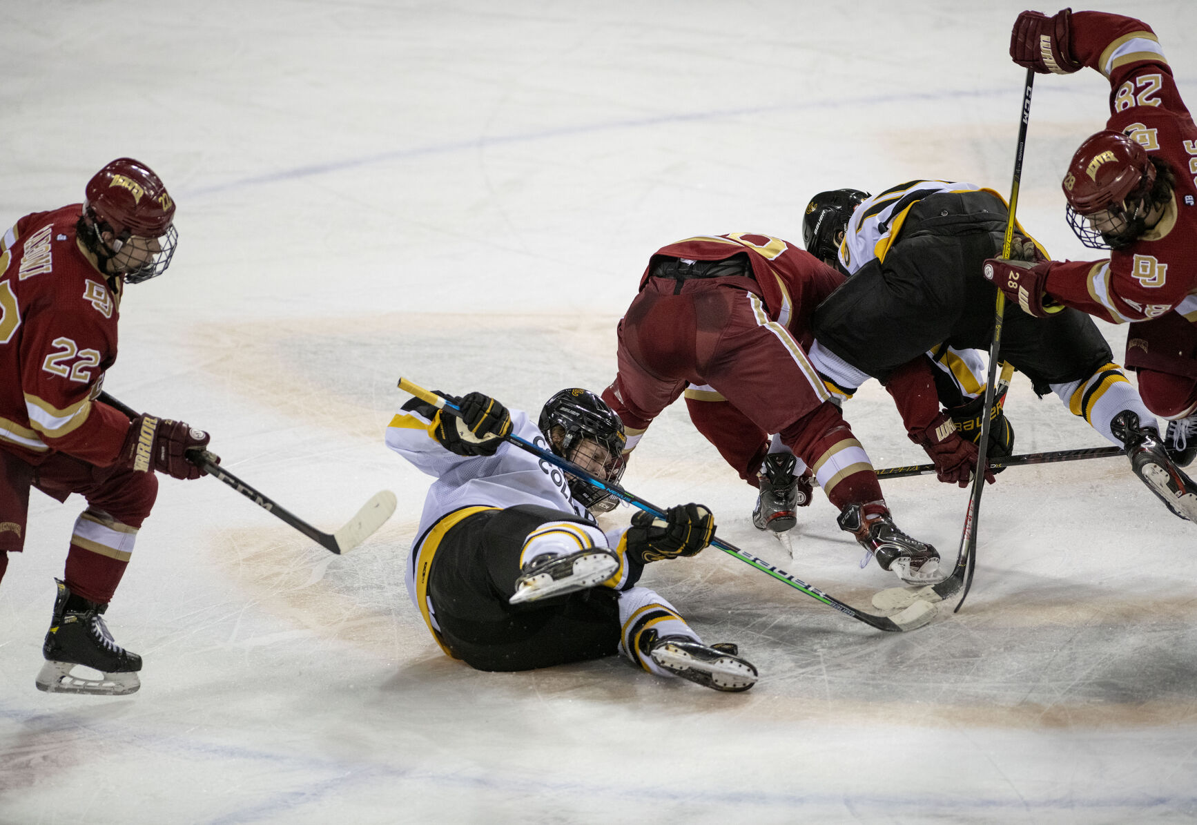 Colorado College freshman forward Jackson Jutting (16) battles for the puck during the Battle for the Gold Pan against DU at The Broadmoor World Arena in Colorado Springs on Thursday, Feb. 25, 2021. (Chancey Bush/ The Gazette) (Chancey Bush/ The Gazette)