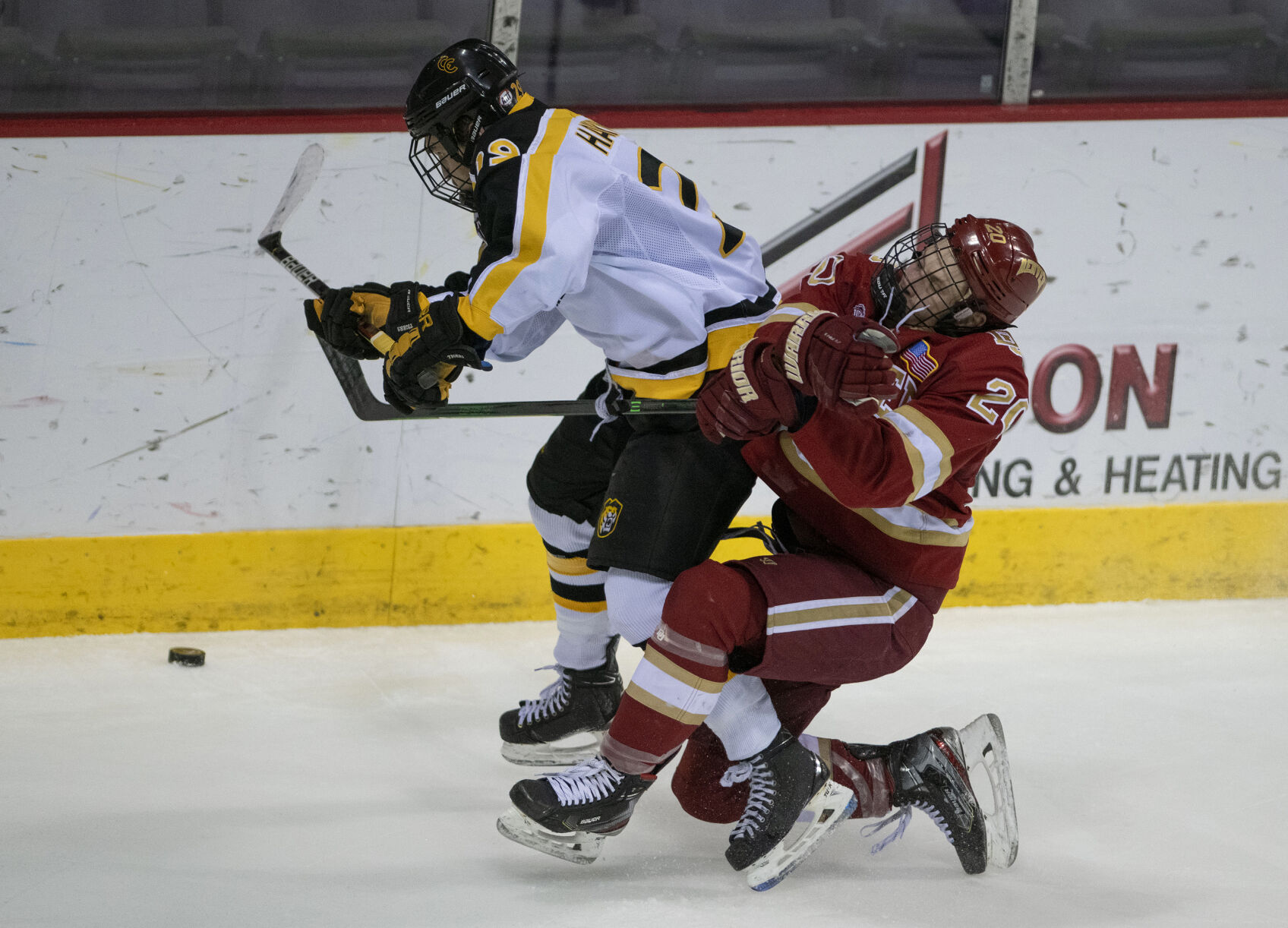 Colorado College junior forward Brian Hawkinson (29) Denver freshman defenseman Mike Benning (20) get tangled up during college hockey game as the CC Tigers and DU Battle for the Gold Pan at The Broadmoor World Arena in Colorado Springs on Thursday, Feb. 25, 2021. Denver won the game against the CC Tigers by a score of 5 to 1. (Chancey Bush/ The Gazette) (Chancey Bush/ The Gazette)