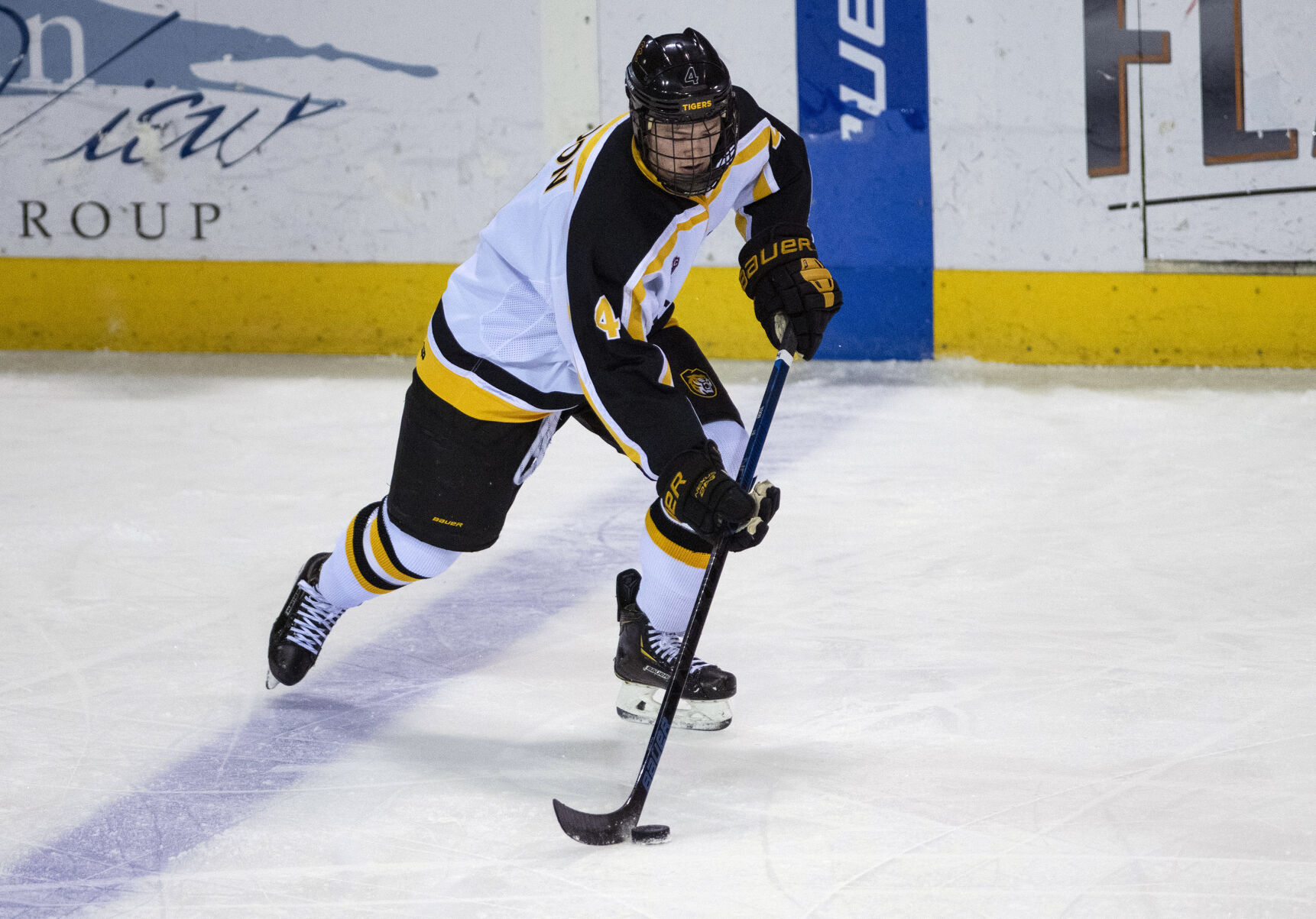 Colorado College junior defenseman Bryan Yoon (4) gains possession of the puck during college hockey game as the CC Tigers and DU Battle for the Gold Pan at The Broadmoor World Arena in Colorado Springs on Thursday, Feb. 25, 2021. Denver won the game against the CC Tigers by a score of 5 to 1. (Chancey Bush/ The Gazette) (Chancey Bush/ The Gazette)