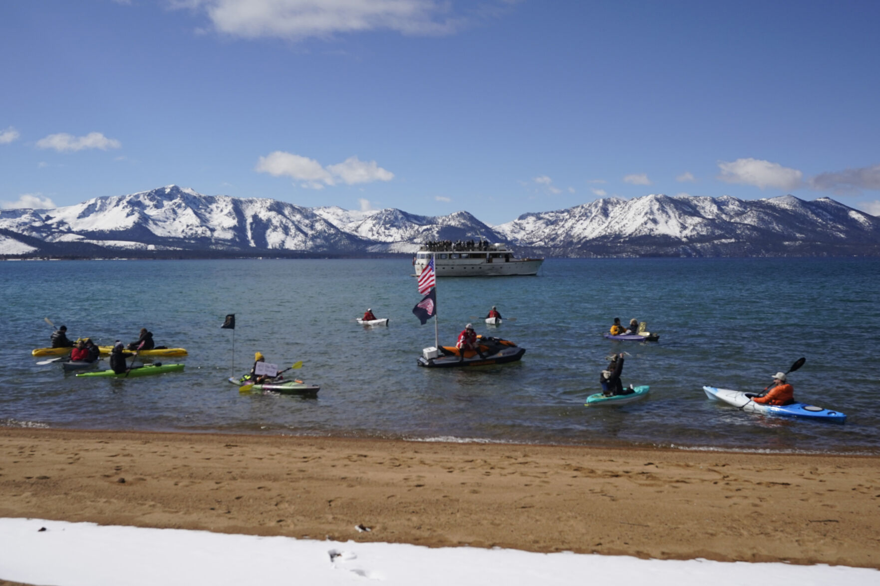 Watercraft of various types float on Lake Tahoe on Lake Tahoe offshore of the temporary ice rink where the Golden Knights will play the Colorado Avalanche in an NHL hockey game at Stateline, Nev., Saturday, Feb. 20, 2021. (AP Photo/Rich Pedroncelli)) (Rich Pedroncelli)