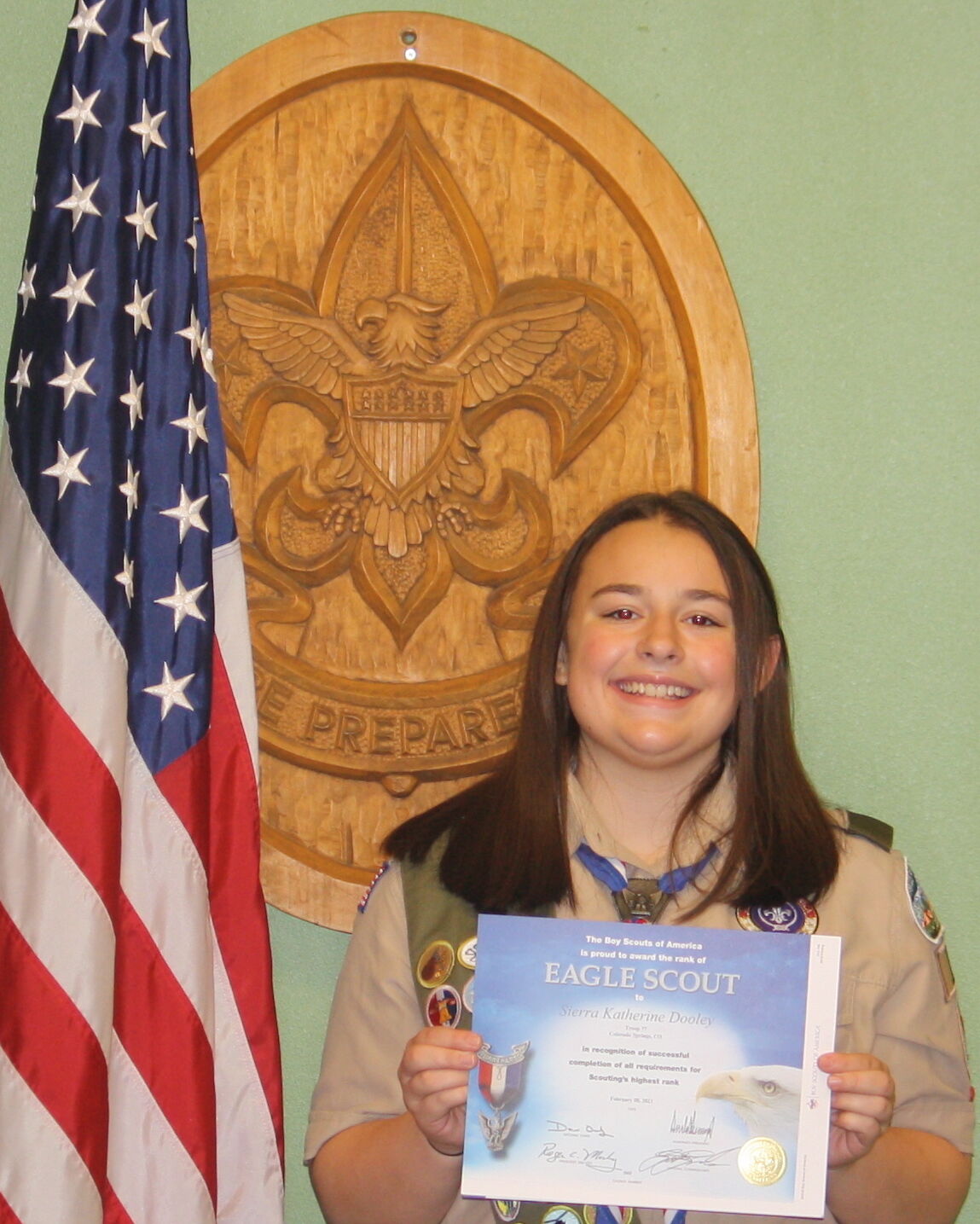Sierra Dooley displays the certificate identifying her as one of the first female Eagle Scouts in the 111-year history of the Scouts program. (Photo by O'Dell Isaac, The Gazette)