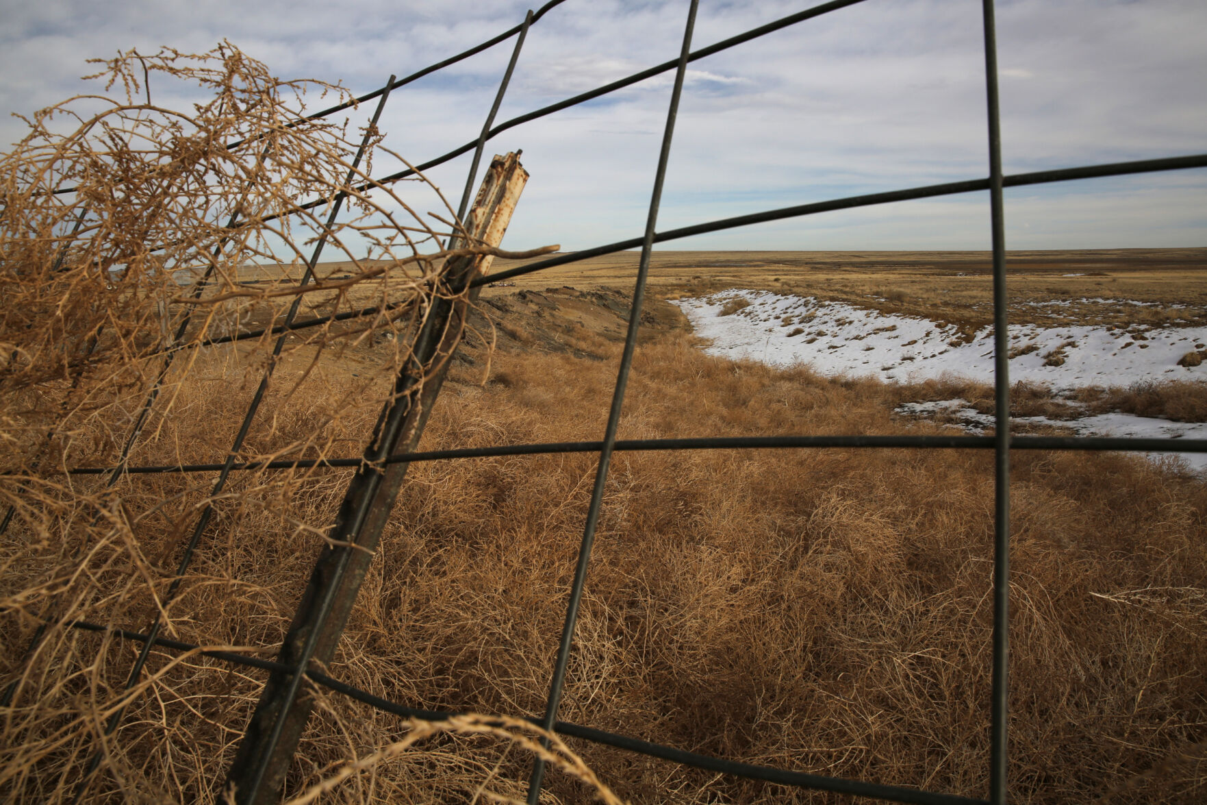 An old ditch leading to a defunct reservoir near The Dry is filled with thousands of tumbleweeds. The reservoir, along with several others, was intended to hold water for residents of The Dry and the surrounding area, but those hopes never came true, and years after they were created, they sat empty and dry. (Forrest Czarnecki/The Gazette) (Forrest Czarnecki)
