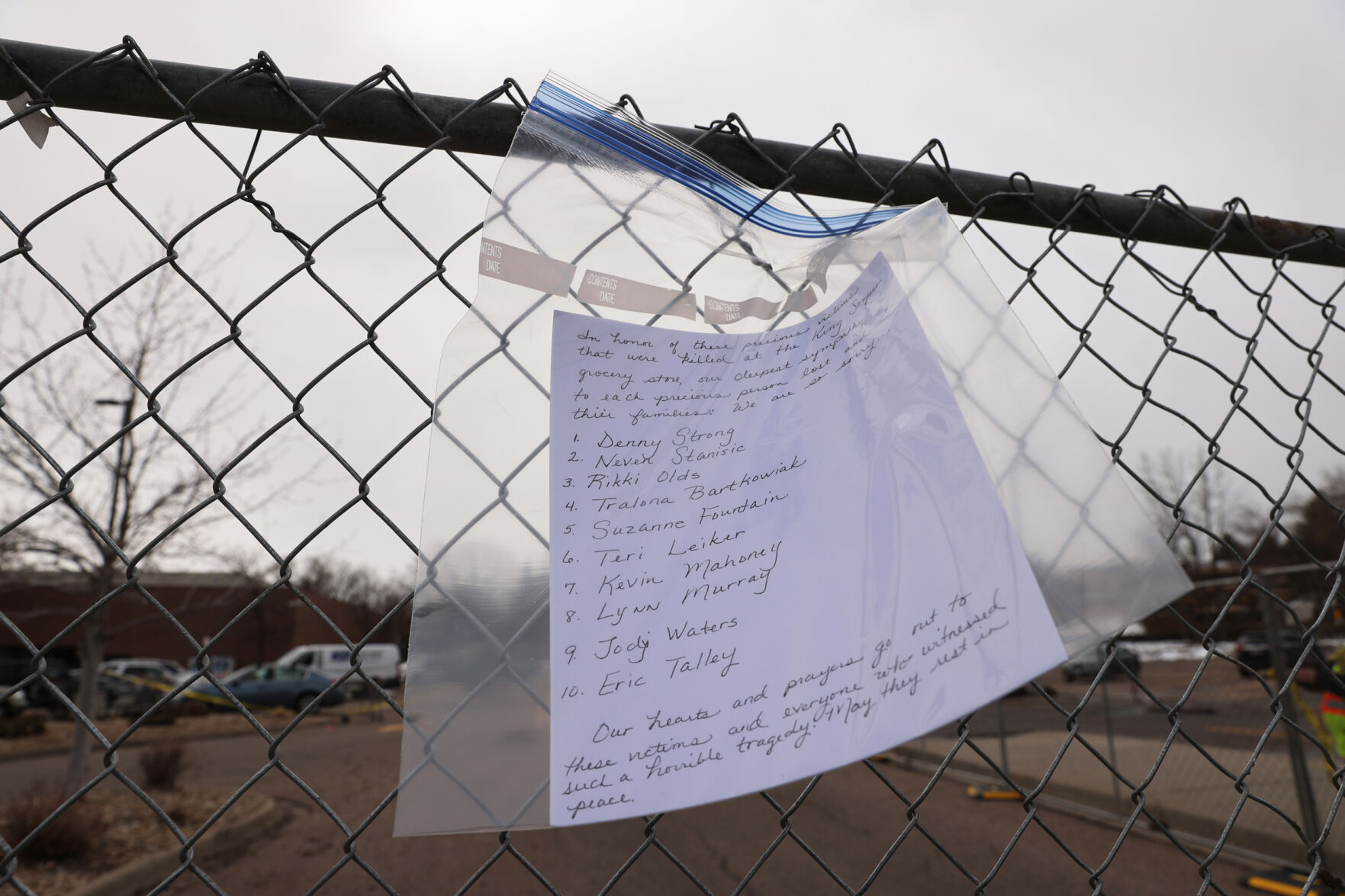 The names of the victims are seen on a piece of paper attached to the perimeter fence at the King Soopers on Table Mesa Drive in Boulder on March 23, 2021. A gunman killed 10 people in a mass shooting at the store the day before. (Forrest Czarnecki/The Gazette) (Forrest Czarnecki)