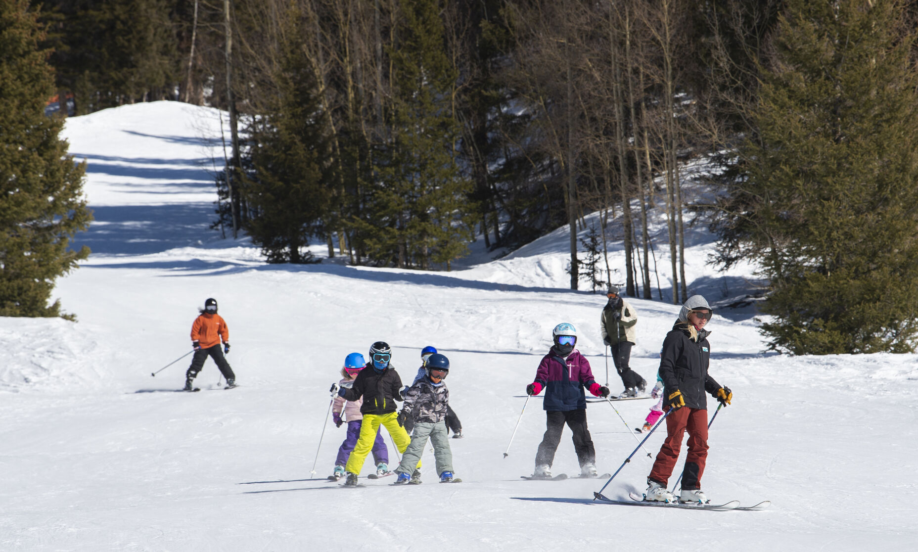 Students ski down the Mayflower green run at Kendall Mountain Ski Area while taking a lesson Feb. 26. (photos by Christian Murdock, The Gazette)