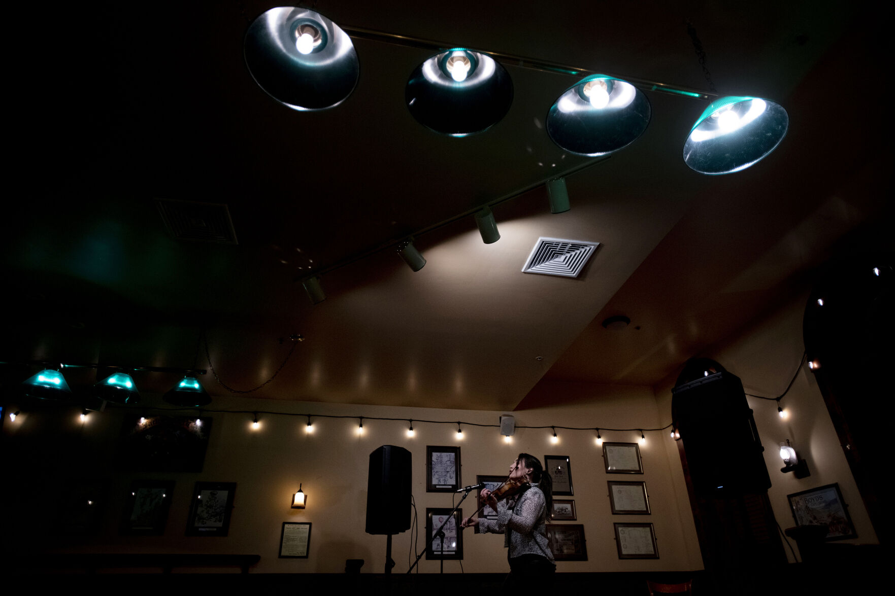 Nerea Gourlaouen, or Nerea the Fiddler, performs Irish music on her fiddle and step dances at Jack Quinn’s Irish Pub and Restaurant in downtown Colorado Springs on Saturday, Feb. 27, 2021. At the age of 15, she named herself the Crazy Fiddle Lady on her YouTube channel, referencing her ability to simultaneously fiddle and step dance. (Chancey Bush/ The Gazette) (Chancey Bush/ The Gazette)