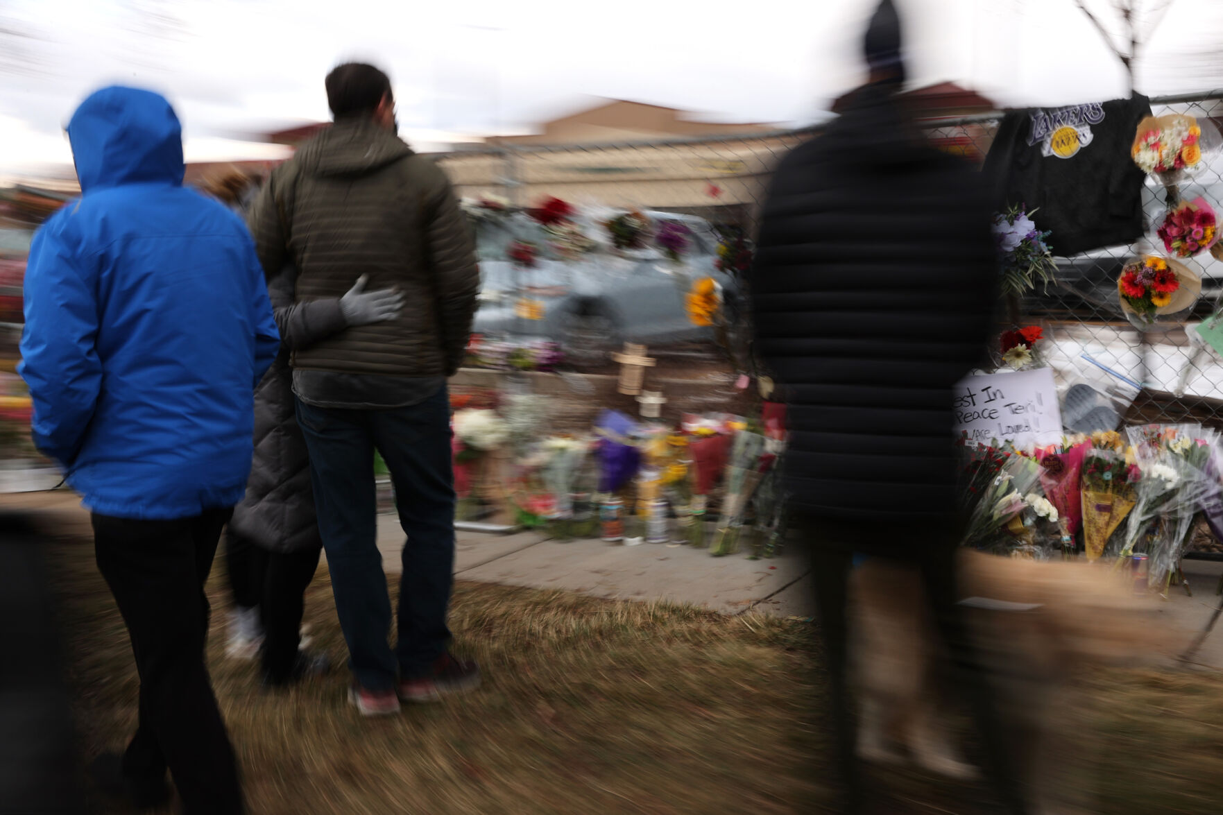 Community members visits the memorial outside the King Soopers on Table Mesa Drive in Boulder on March 23, 2021. A gunman killed 10 people in a mass shooting at the store the day before. (Forrest Czarnecki/The Gazette) (Forrest Czarnecki)