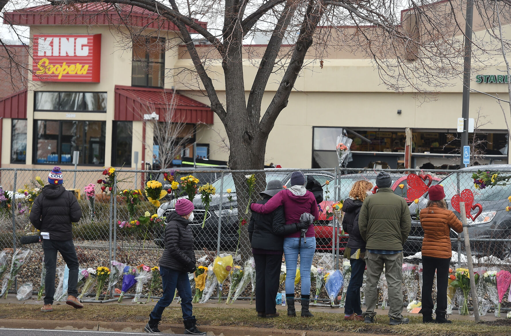 The flowers were growing by the hour on Tuesday, March 23, 2021. They were left by multitudes of mourners for the 10 people killed at the Boulder King Soopers on Monday. (Photo by Jerilee Bennett, The Gazette) (JERILEE BENNETT)
