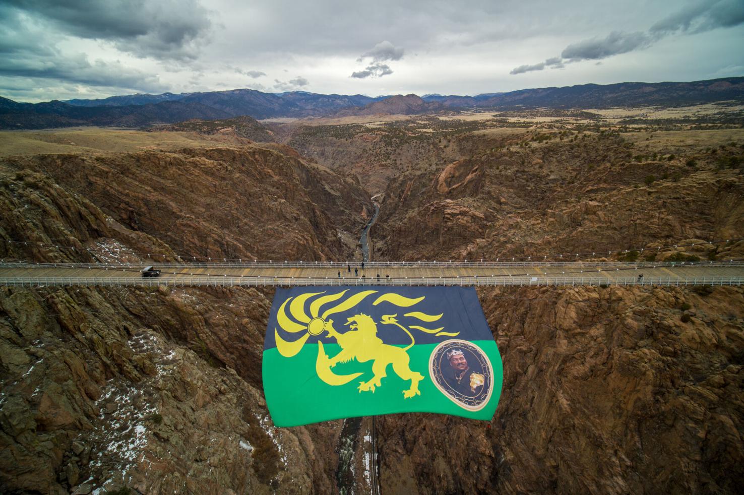 Enormous flag featuring Eddie Murphy being flown from the Royal Gorge Bridge