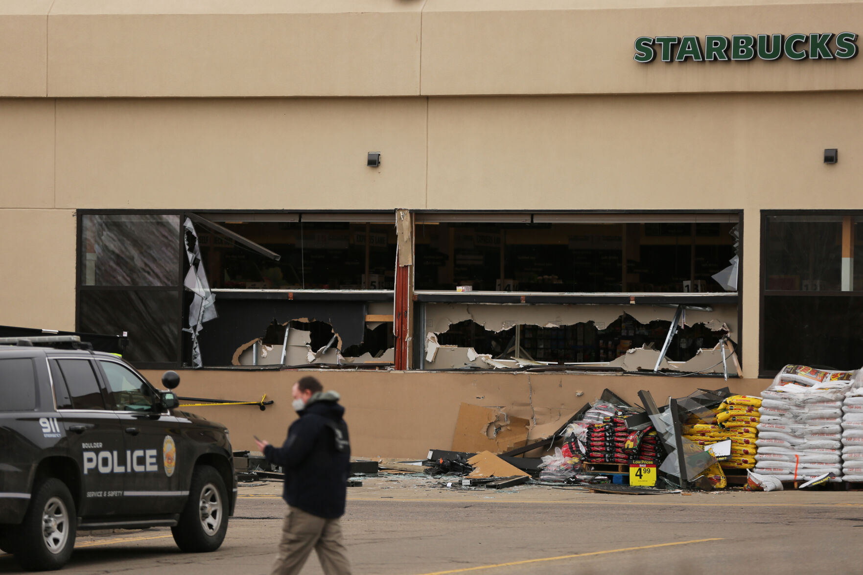 An investigator walks in front of the King Soopers on Table Mesa Drive in Boulder on March 23, 2021. A gunman killed 10 people in a mass shooting at the store the day before. (Forrest Czarnecki/The Gazette) (Forrest Czarnecki)