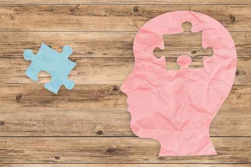 mental health concept with side face and jigsaw pieces