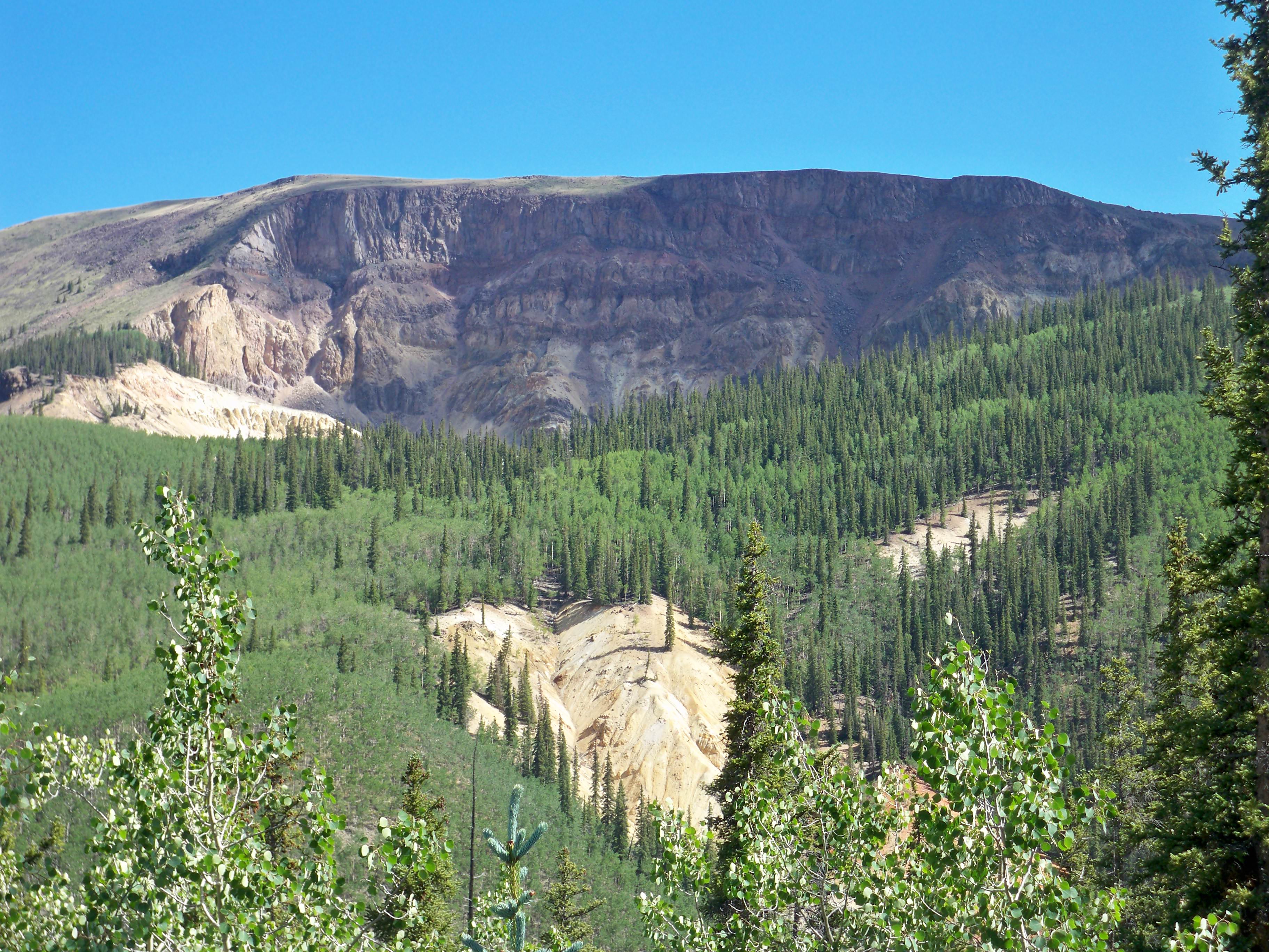 4. Slumgullion EarthflowSlumgullion Pass follows the low point of a ridge that drops down to Lake Fork of the Gunnison River. This ridge dammed the river and created Lake San Cristobal, which is Colorado’s second largest natural lake, about 700 years ago. This ridge is a result of an earthflow caused by heavy rains that saturated and washed out weak volcanic rock, ash, and gravel.This massive mudslide carried the southern flank of Mesa Seco several miles down the mountainside. About 350 years ago, a second earthflow started from the top of the mountain and is still moving today at a rate as high as 20 feet per year.Photo Credit: Gena Montgomery.