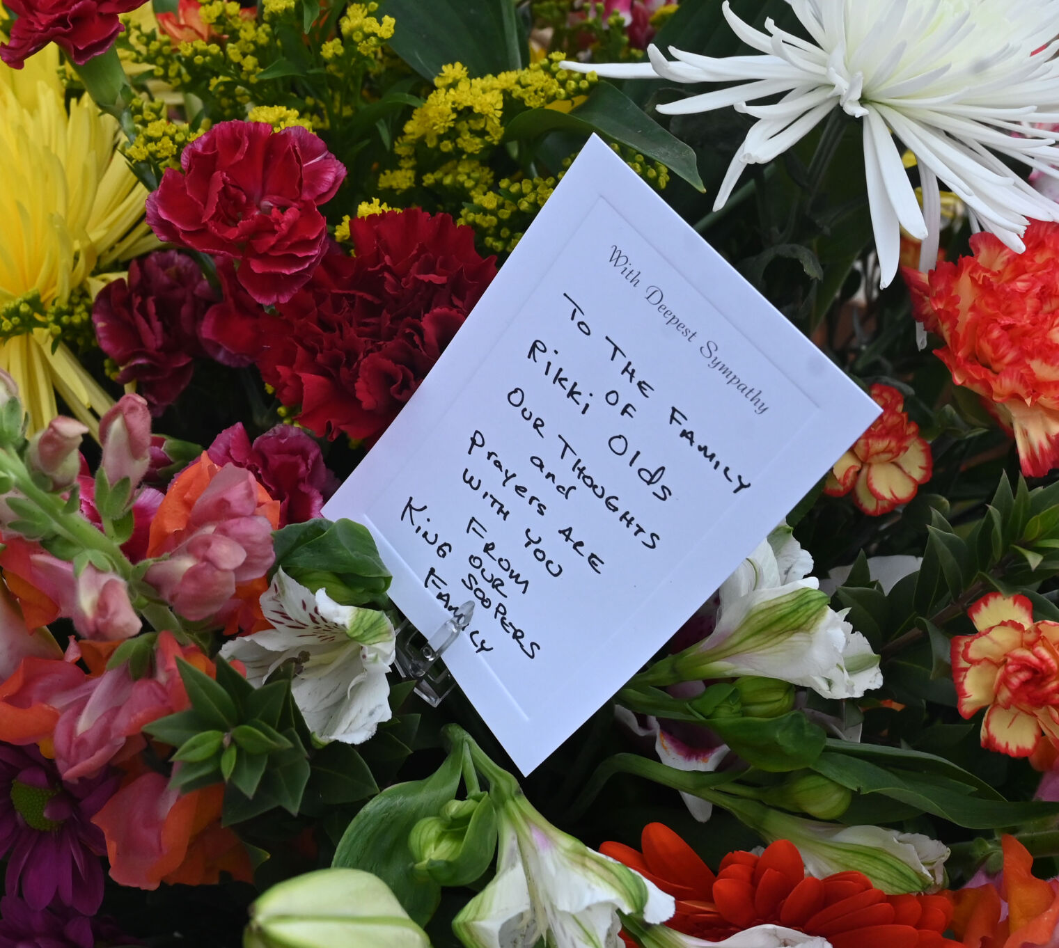 King Soopers employees brought large sprays of flowers for each of the victims of the mass shooting. (JERILEE BENNETT)