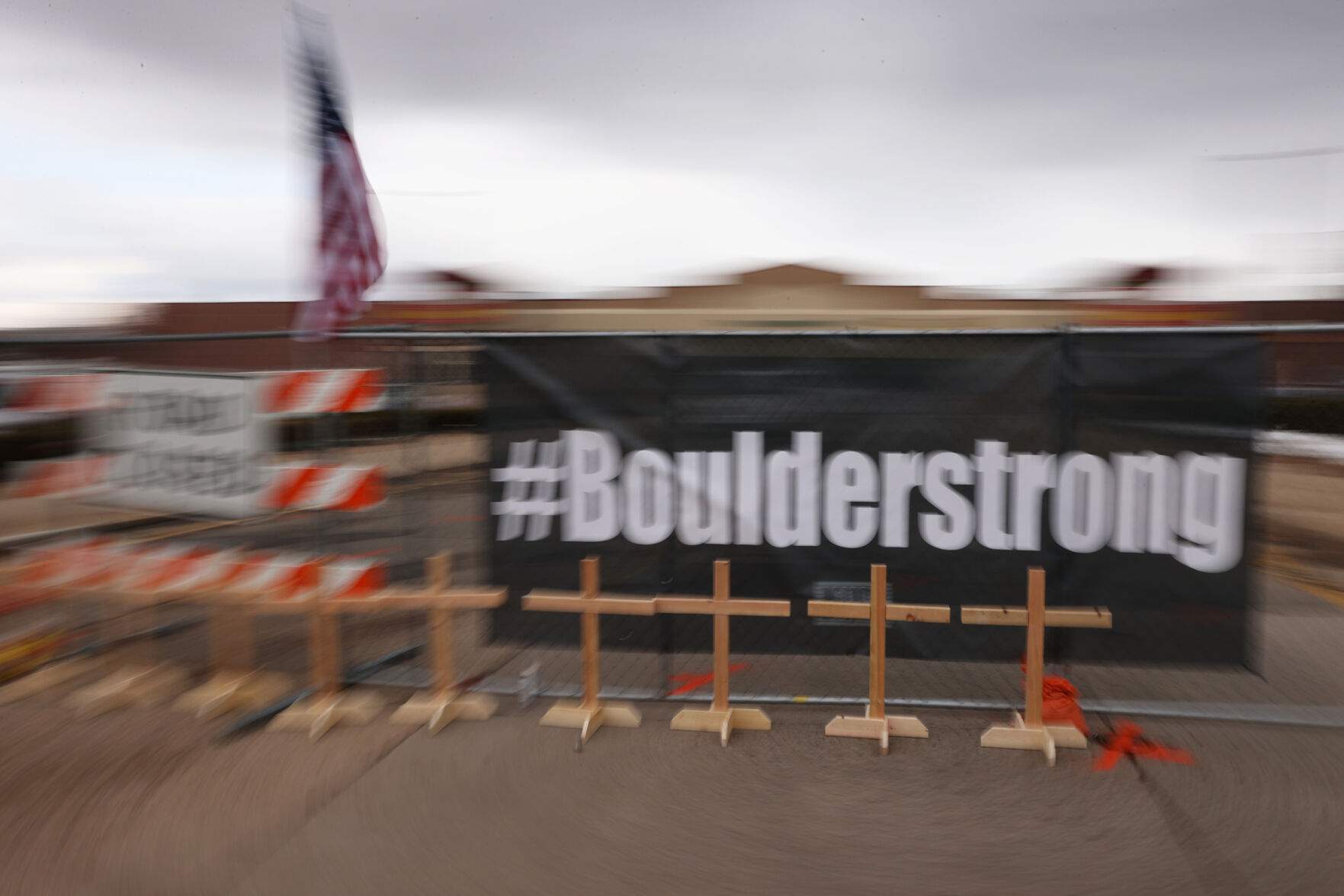 Wooden crosses for each of the victims stand in front of a #BoulderStrong banner outside the King Soopers on Table Mesa Drive in Boulder on March 23, 2021. A gunman killed 10 people in a mass shooting at the store the day before. (Forrest Czarnecki/The Gazette) (Forrest Czarnecki)