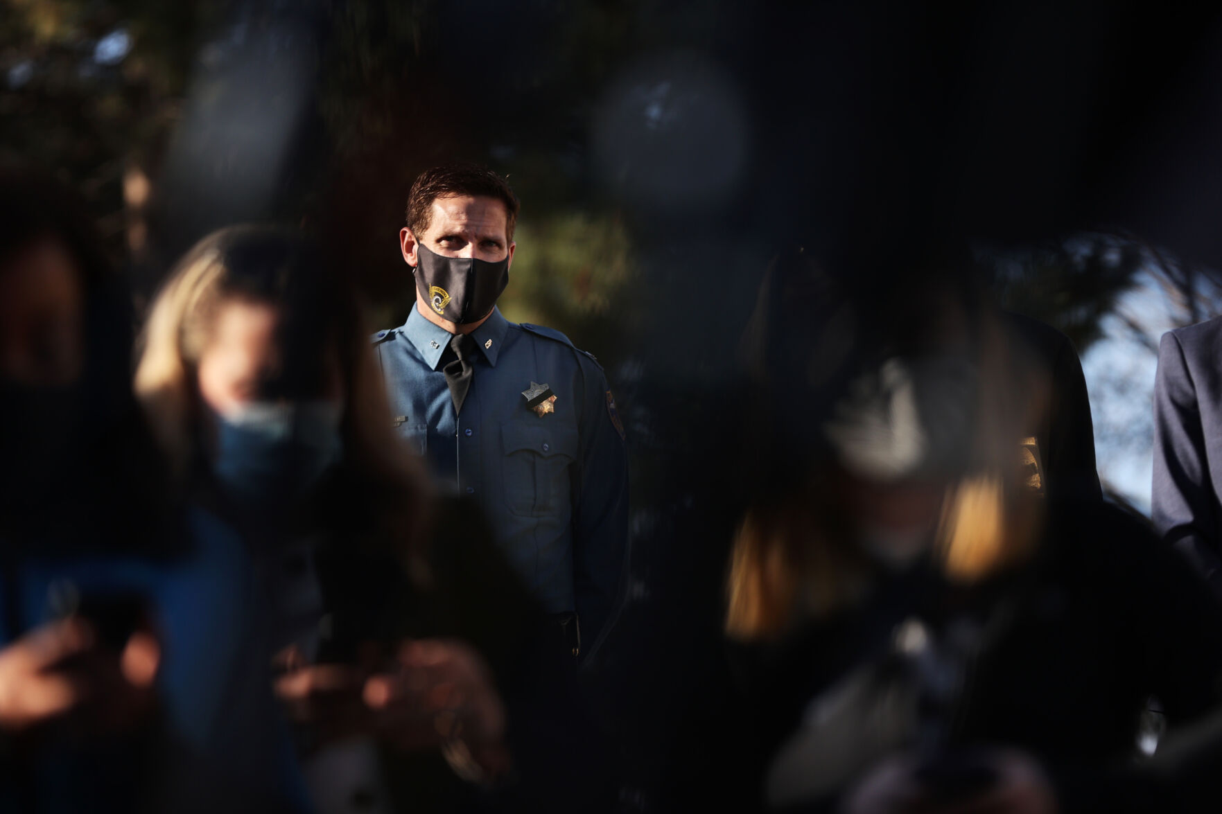 A Colorado State Patrol officer listens to a press conference outside the Boulder Police Department on March 23, 2021. A gunman killed 10 people, including Boulder police officer Eric Talley, in a mass shooting at a King Soopers in town the day before. (Forrest Czarnecki/The Gazette) (Forrest Czarnecki)
